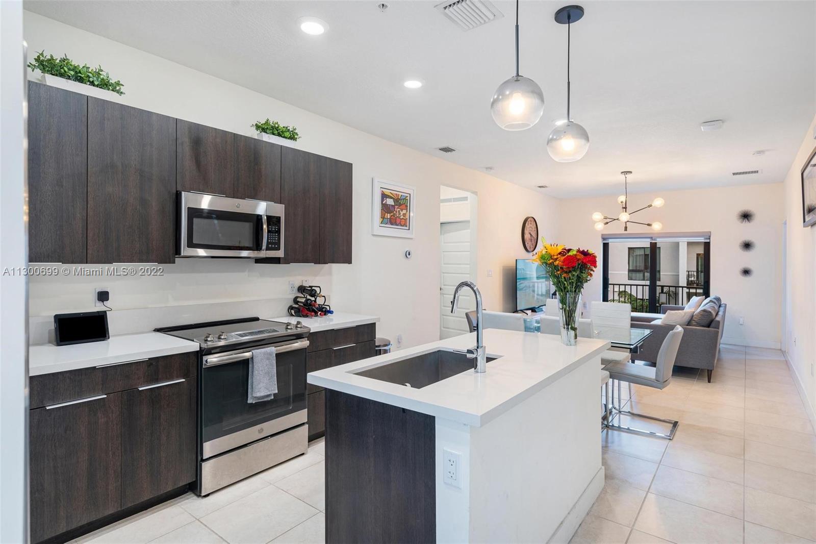 Own in the Desirable area of Downtown Doral! Dining, Shopping, Golfing, and Entertainment are right outside your door. This 3 Bed 2 Bath unit is located in the brand new Urbana community. The amenities include a beautiful club house with a pool, basketball court, business center, playground, and many more. If you like the idea of turn-key look no further because this is it. Built in 2019 the unit features Quartz counters, a balcony, tile floors in the living area, spacious bedrooms, and an en-suite primary bathroom. Not only is immediate area fantastic but you can get to downtown Miami in under 20 minutes. Easy access to highways, airports, while also being a very walkable area. This will not last so call today to book an appointment.