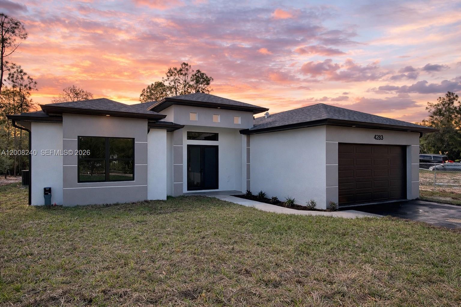 Positioned on a 100% upland lot, this thoughtfully designed 4 bedroom, 2 bathroom home with 2,004 sq ft under ac and 2,676 total sq ft - offers the perfect blend of space, privacy, and functionality in Golden Gate Estates. The home features a split-bedroom layout for optimal privacy and a spacious, open-concept design with attention to detail throughout. Enjoy seamless indoor-outdoor living with a large lanai and summer kitchen, ideal for entertaining or relaxing while overlooking your expansive property. Inside, you’ll find beautiful finishes and a luxurious master bathroom that elevates everyday living. Located on 10th St NE, this property benefits from new and upcoming retail development nearby, making it one of the most desirable areas in the Estates - offering convenience and growth while still maintaining a peaceful, private setting. A fantastic opportunity to own a fully usable upland property with room to grow, add a pool, work barn, animals & create your ideal outdoor space!