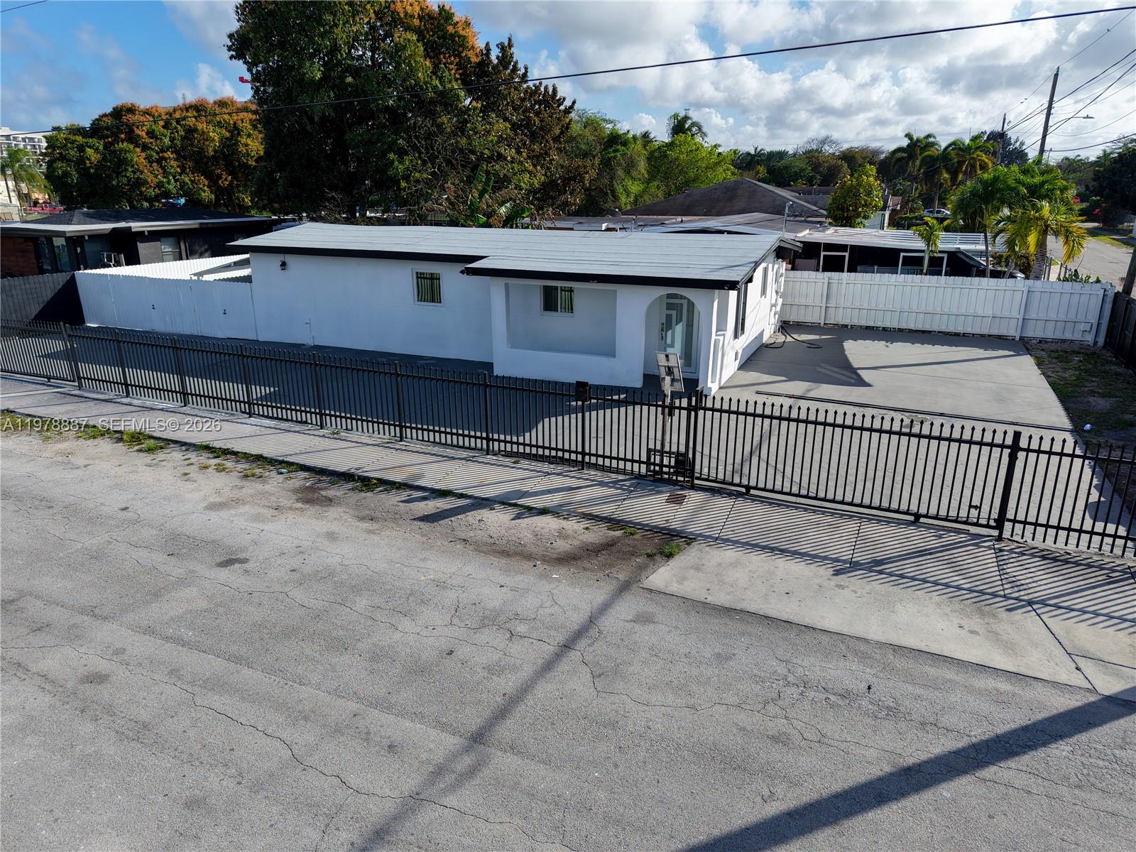 Amazing Investor CASH-FLOW Opportunity / Owner Occupancy!! Ready to Move-in and Completely Updated 3 Bedroom and 3 Full baths Single family Dwelling!! Submit your Offer Today! This beautiful property offers comfort, security, and exceptional space — perfect for a family or multi-generational families too. Located on a large corner lot, in a fast developing appreciating area. This property offers abundant parking space for multiple vehicles, including cars, boats, trucks, trailers, or Work/ Business vehicles. This makes it an ideal option for entrepreneurs, contractors, or business owners who need extra parking and flexibility. INCENTIVES!! Upgrades include: Impact windows and doors, double electric gates for security and easy access, new electrical panel, new plumbing, new A/C unit, New floors, freshly painted. Great home for families, or with additional income potential. Text for Appointment
