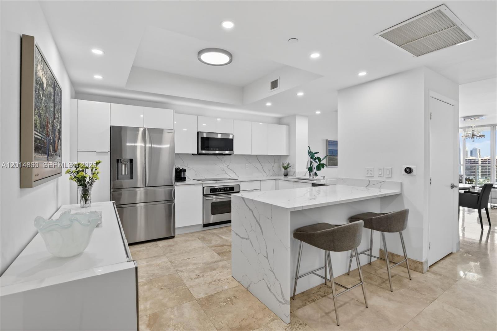 WOW! ENTER THIS AMAZING RENOVATED RESIDENCE AND IMMEDIATELY & THROUGHOUT SEE THE BEST VIEWS. NEW WHITE & BRIGHT - RENOVATED OPEN KITCHEN - NEW BATHROOMS - STUNNING CUSTOM LIGHTING. COVETED SPLIT BEDROOM PLAN, TWO BEDROOMS PLUS DEN/OR 3RD BEDROOM, 3 BATHS. ALL REDONE. NEW AIR CONDITIONING. IMPACT GLASS WINDOWS. LARGE TERRACE. LARGE PRIMARY SUITE WITH TERRACE, WATER VIEWS, LARGE WALK IN CLOSET, NEW WHITE BATH WITH DUAL SINKS. UTILITY ROOM W/WASHER & DRYER. A GEM!
AMENITIES INCLUDE 2 CLUBHOUSES W/KITCHEN FACILITIES, BILLIARDS ROOM, 2POOLS, JACUZZI, NEWLY REMODELED MAIN GYM W/NEW EQUIPMENT IN WEIGHT, CARDIO, AND AEROBIC ROOM OFFERING DAILY CLASSES, COLD PLUNGE ROOM, STEAM/SAUNA, NEW DOG PARK, LOCATED NEXT TO FOUNDERS PARK, PICKLEBALL/TENNIS/BASKETBALL COURTS, AVENTURA MALL! WONT LAST! NO ASSESSMENTS!