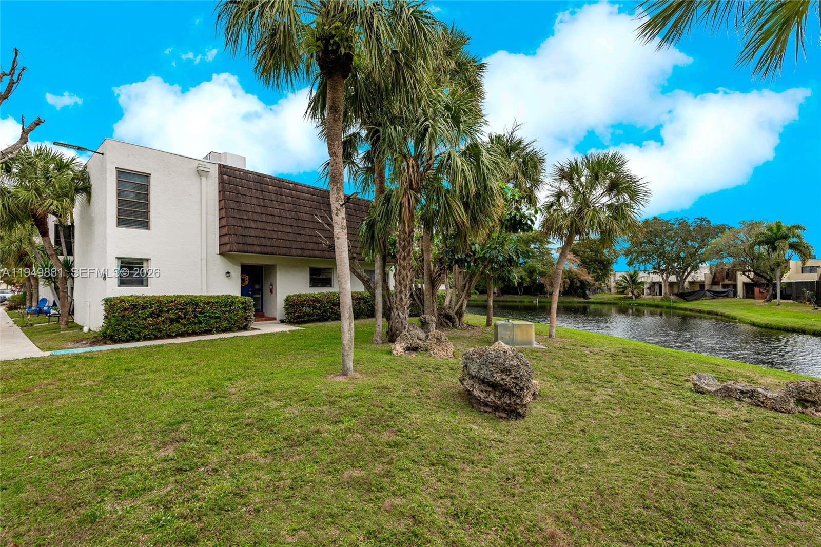 Welcome to this stunning waterfront corner townhome offering the perfect blend of comfort, style, and opportunity. Featuring 4 bedrooms and 2.5 bathrooms, this home boasts sleek laminated flooring throughout and an abundance of natural light. Upstairs, three spacious bedrooms await, with two beautifully remodeled and a primary suite taken down to the frame—ready for you to design your dream retreat. Enjoy tranquil lake views and a private balcony from the primary bedroom.

The first floor features a remodeled bedroom and bathroom, ideal for guests or a home office. The modern kitchen shines with brand-new stainless steel appliances, including a refrigerator, dishwasher, electric range, and microwave. The open living area captures breathtaking lake views and opens effortlessly to a private patio—perfect for relaxing or entertaining by the water.

Additional upgrades include a brand-new roof currently being installed and a new AC system, offering added peace of mind and value. Nestled in the highly sought-after Pembroke Pines, this exceptional waterfront home is a rare find with endless potential. Don’t miss the chance to make it yours!
