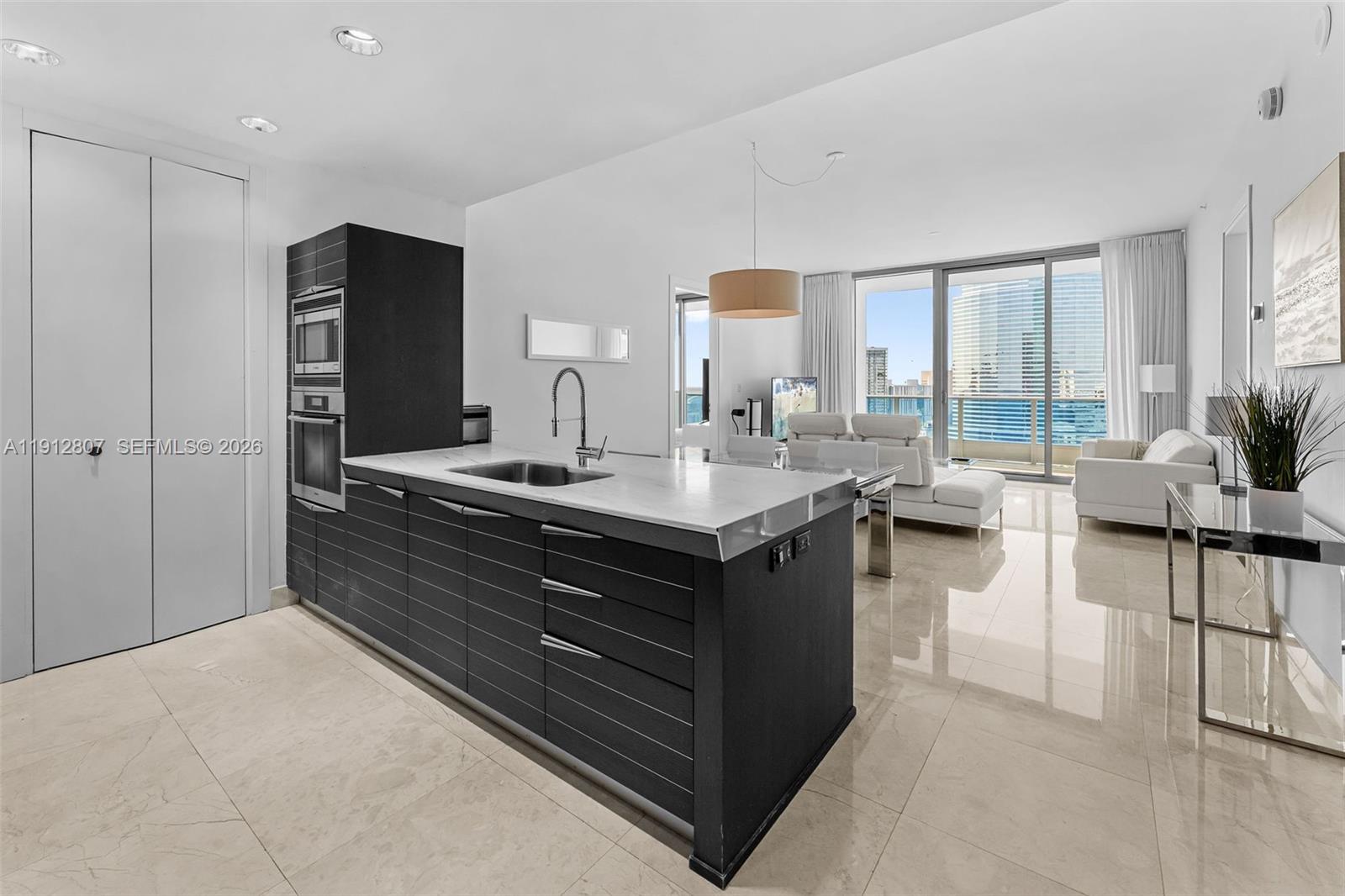 Live in the heart of Downtown Miami in this stunning 2 Bed + Den with 2.5 Bathrooms at the Epic Residences. This residence has 10-foot ceilings, floor-to ceiling windows,  top-of-the-line finishes, an oversized private balcony, and panoramic city views.  Enjoy world-class amenities including: 2 fine dining restaurants on-site, a full-service spa and state-of-the-art fitness center,  two resort-style pools,  conference/business rooms, boat dockage, valet & more.  Walk to Brickell City Center, Whole Foods, office buildings, nightlife and more. Available furnished. Storage space included