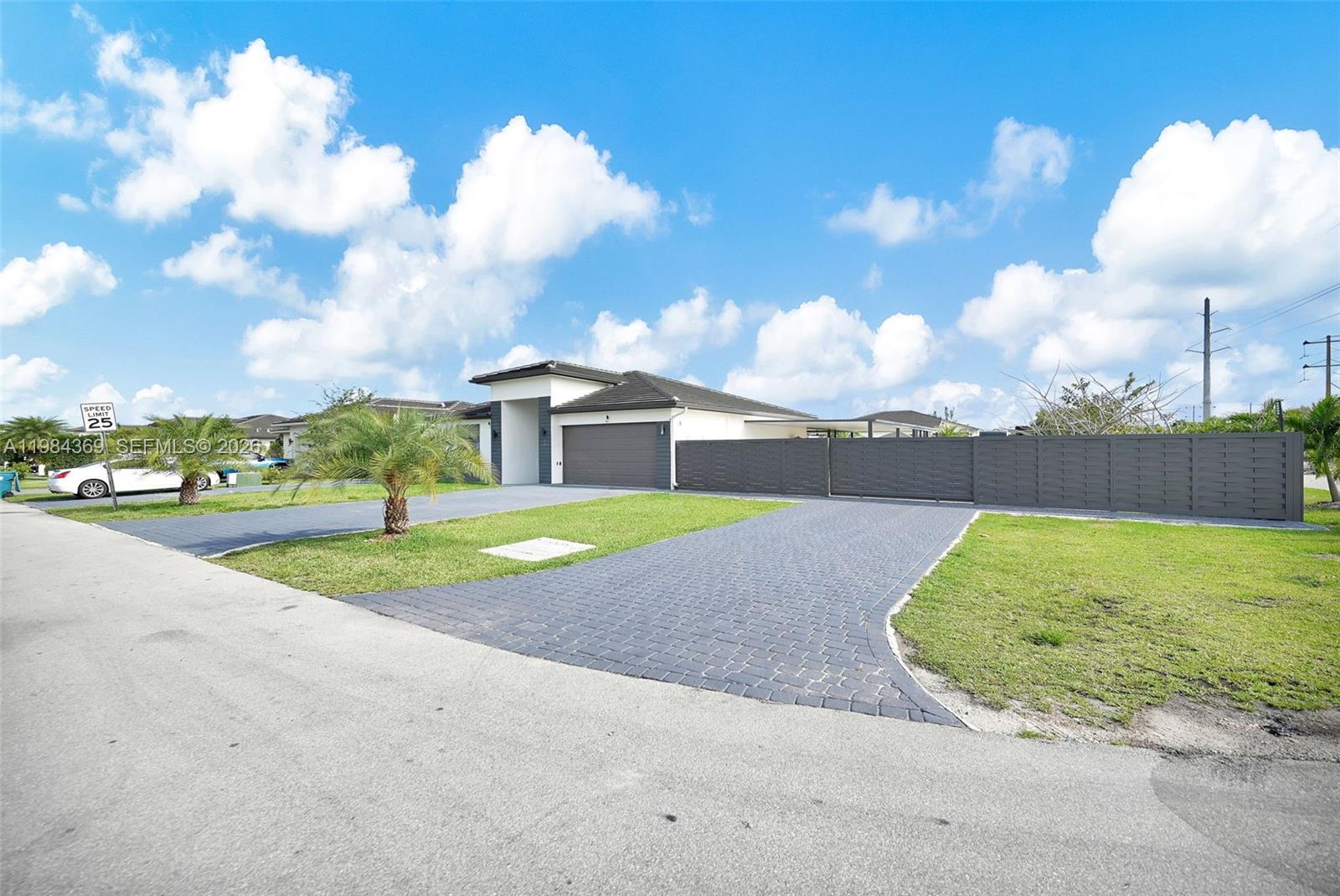Modern luxury home, completely new and remodeled, situated on half an acre of private land. It features 5 spacious bedrooms and 4 bathrooms with high-end finishes.
Contemporary design with high ceilings, floor-to-ceiling windows, and open floor plan. Elegant kitchen with quartz island and modern appliances, seamlessly integrated with the living and dining areas. NO HOA.