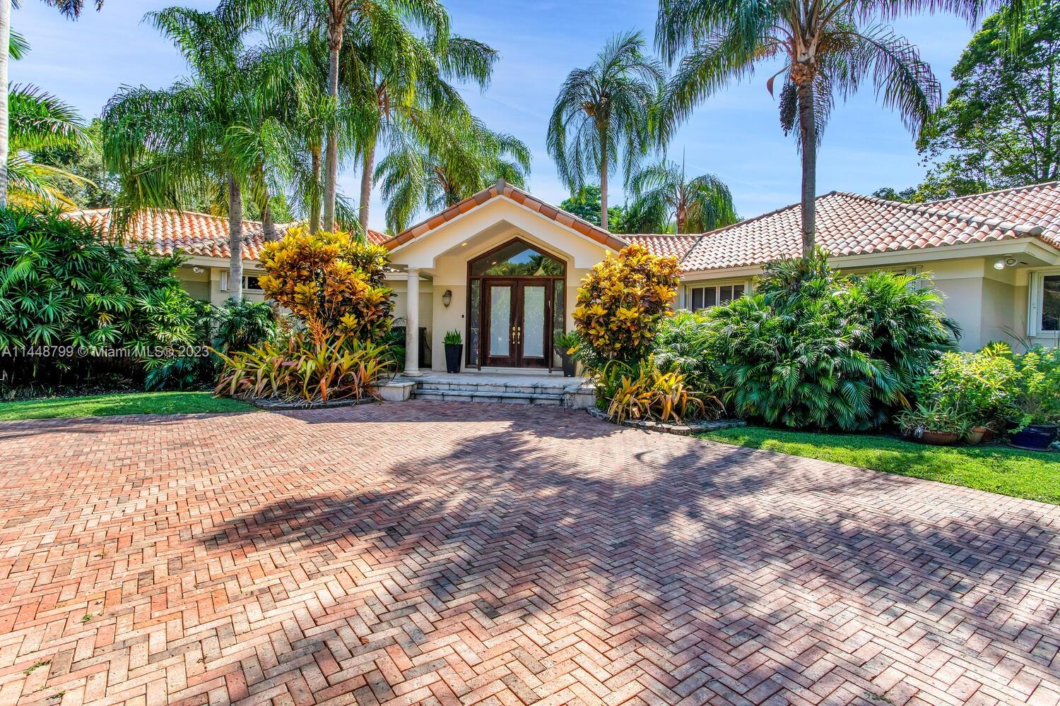 Imposing and elegant custom gated estate on one of the most desirable north Pinecrest streets, situated on private cul-de-sac. Lush acre laden with oak and tropical plantings. Unique architectural design of an excellent open flow floor plan, luxury finishes throughout, features vaulted ceiling, marble & wood flooring. Oversized picture windows, sunlit drenched interiors. Formal living and dining rooms lead to beautiful and expansive family room. gorgeous and updated gourmet dream kitchen centered around an expansive island equipped w/ top of line appliances and breakfast area. Magnificent grounds, sparkling large pool/spa. Roofed patio w/ built-in BBQ. Split private primary suite w/garden vistas. Excellent top Pinecrest public and private schools are all closed by! Fabulous offering !
