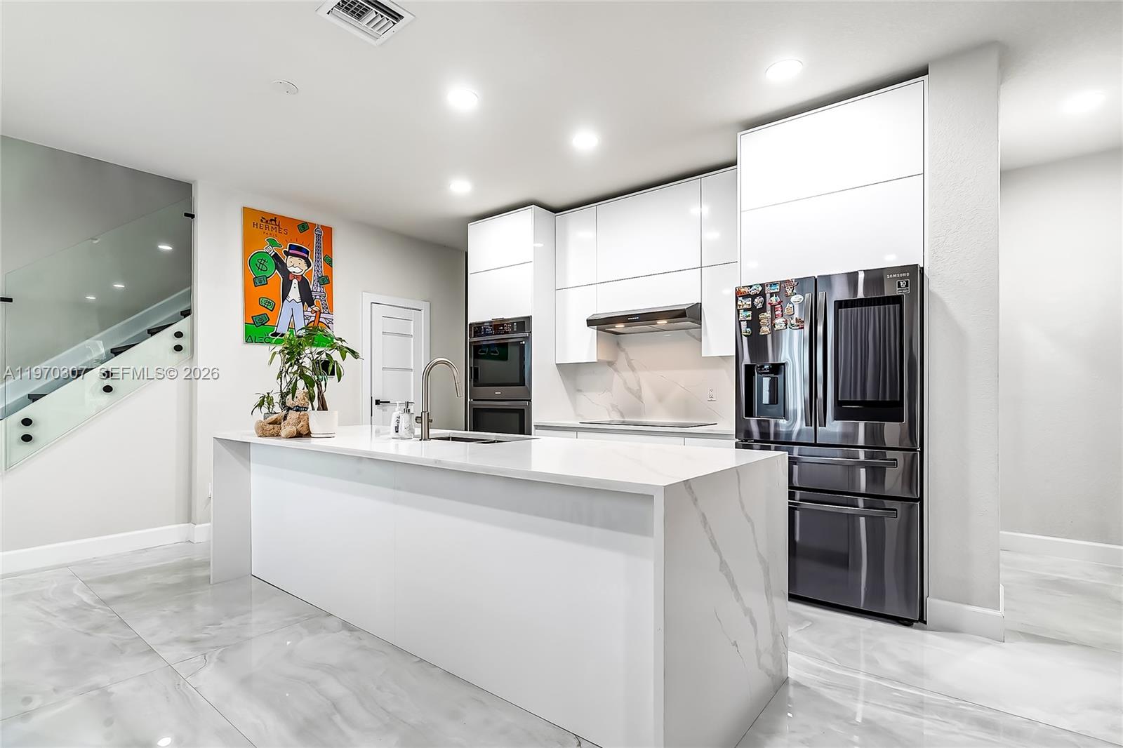 Stunning, fully upgraded residence offering 4 bedrooms + den and 3 bathrooms with 2,168 SF under A/C, originally built in 2020 and extensively remodeled with high-end finishes throughout.

This move-in-ready home features a brand-new designer kitchen with modern cabinetry, premium appliances, and upgraded finishes. The first floor showcases oversized 24” x 48” porcelain tile, while the second floor is finished in real hardwood, creating a warm and elegant atmosphere. All bathrooms have been fully remodeled with contemporary fixtures and finishes, and solid interior doors add to the refined feel of the home.

Additional upgrades include impact windows and doors, a whole-house generator with an in-ground gas tank, an extended screened patio with electric shutters, and a Tesla EV charger. One bedroom and one full bathroom are conveniently located on the first floor, ideal for guests or multigenerational living.

Located in the gated community of Parkview at Hillcrest, residents enjoy resort-style amenities including a clubhouse with bar and catering kitchen, activity room, large pool, fitness center, barbecue area, playground, tennis courts, and scenic walking trails.

Just minutes to Hollywood Beach, 2.4 miles to Memorial Hospital, and close to Target, Publix, Winn-Dixie, dining, and major highways.

Turnkey condition. Better than new.