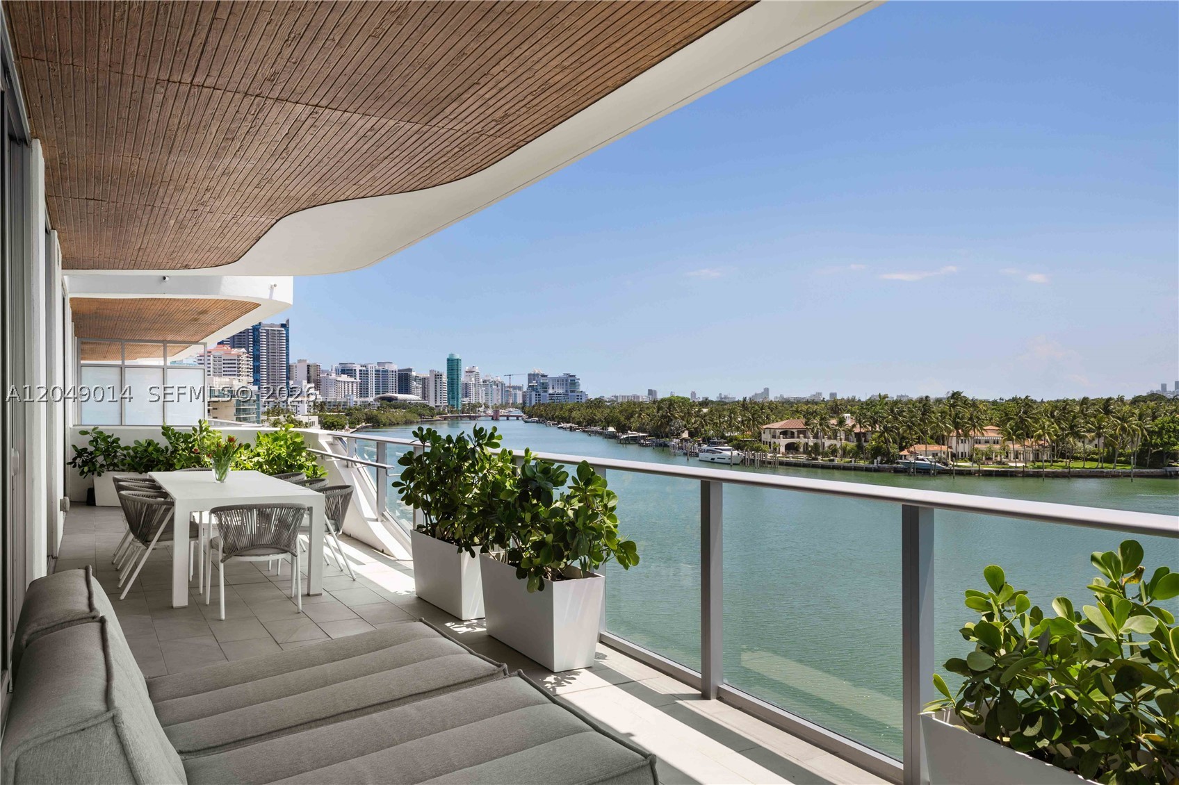 Live the Miami Beach lifestyle in this designer-finished, furnished residence at Monaco Yacht Club. Completed in 2022, this exclusive boutique waterfront building was designed by Arquitectonica, offering modern luxury in one of Miami Beach’s most desirable neighborhoods. This spacious corner residence showcases sweeping bay views and has been thoughtfully curated by Studio Santos, with every finish selected with intention. The open-concept living, dining, and kitchen seamlessly flow onto an oversized wraparound terrace, creating the perfect setting for indoor-outdoor living and entertaining. The split floor plan offers exceptional privacy, with the primary suite tucked away from the two guest bedrooms. The spacious primary retreat features a walk-in closet, spa-inspired bath, and direct access to the balcony. Residents enjoy an exceptional collection of amenities, including a waterfront rooftop pool, a state-of-the-art fitness center, 24-hour security, valet service, and assigned parking. Ideally located just moments from the beach, Bal Harbour, Surfside, world-class dining, luxury shopping, parks, and some of Miami Beach’s best lifestyle destinations, this residence offers the perfect balance of tranquility and convenience.