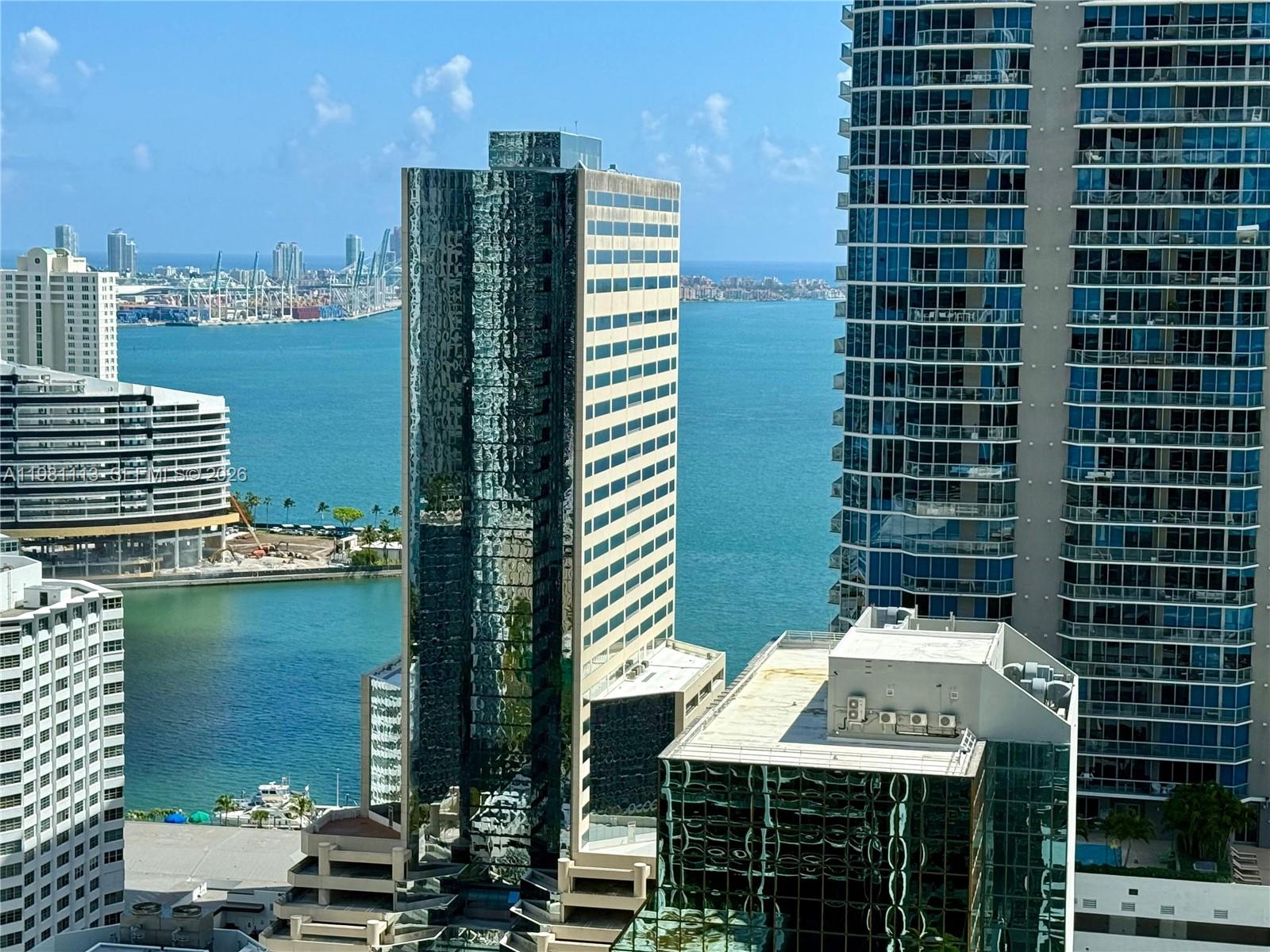 Experience vibrant Brickell living in this bright 1-bedroom residence with stunning bay views. The unit features marble floors throughout, an open-concept kitchen with modern appliances and sleek countertops, and a light-filled living area that opens to an east-facing balcony. The spacious bedroom offers ample closet space and large window framing beautiful city and water views. Ideally located on prestigious Brickell Avenue, just steps from Mary Brickell Village, Brickell City Centre, top restaurants, cafés, and nightlife, with easy access to Metromover and Metrorail. Residents enjoy excellent amenities including a pool, fitness center, concierge, and valet service. The building façade is under renovation; the balcony and pool will remain closed until renovation is completed.