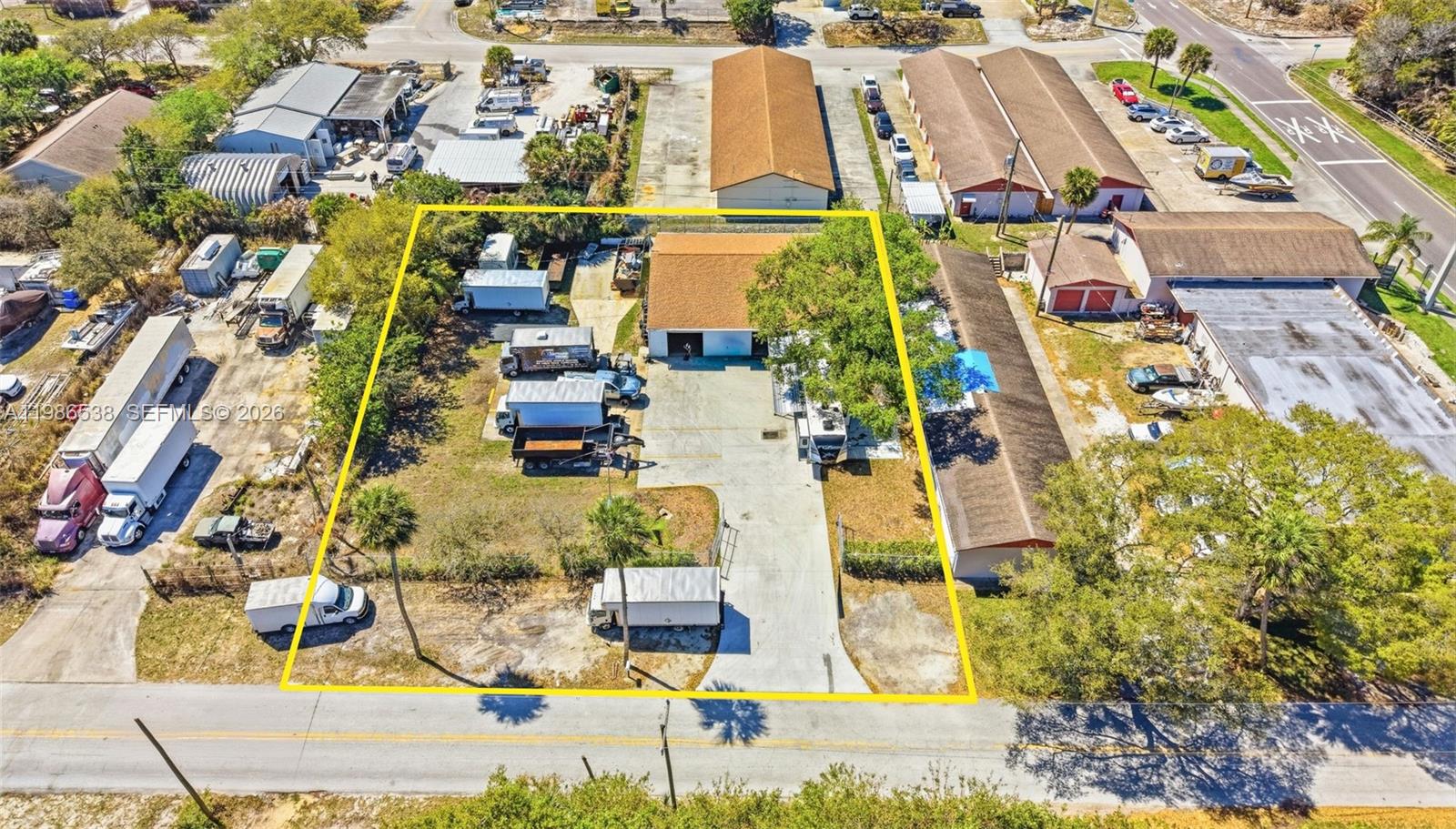 Well-positioned industrial warehouse near US-1 in the growing Sebastian/Vero Beach market. Zoned IN (Industrial), a rare designation in the submarket, offering broad flexibility for owner-users and investors. The property features three-phase power, an 80-gallon air compressor, dual roll-up bay doors, and 12-foot ceilings, ideal for contractor trades, light fabrication, fleet services, and distribution uses. A fully fenced, well-lit yard provides secure equipment and vehicle storage, while a newly installed air-conditioned office with private restroom supports administrative operations. Ample yard space allows for outdoor storage, staging, or future expansion in a supply-constrained industrial market.