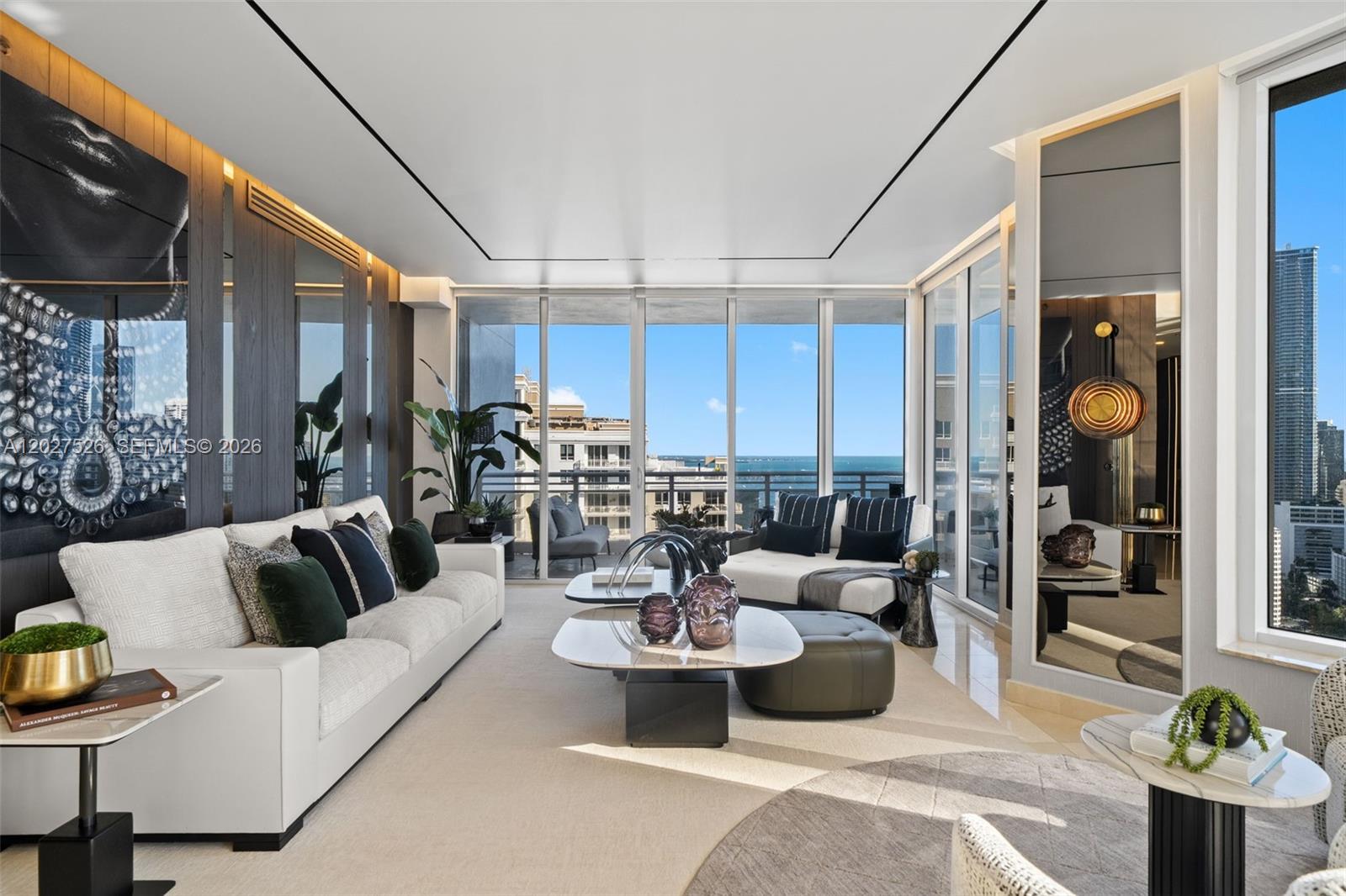 Welcome to Residence 3304 at Carbonell, fully renovated turnkey furnished corner residence featuring an extraordinary 7 assigned parking spaces a unique offering & one of the most unique ownership opportunities in Brickell. Spanning 2,591 SF, this residence has been completely renovated with extensive custom upgrades, high-end designer finishes, custom millwork, integrated lighting, and curated furnishings throughout. Floor-to-ceiling glass and sliding glass doors showcase breathtaking 180-degree views of Biscayne Bay, Downtown Miami, the Miami River, and the city skyline, while expansive terraces extend the living experience outdoors, enjoying sunrise mornings and sunset skies from one of the most desirable corner lines in the building. The residence offers 3 bedrooms, 3.5 bathrooms, expansive living areas, and a beautifully designed chef’s kitchen. Exceptional natural light fills the home from multiple exposures, creating an elegant and sophisticated living environment. Located on the exclusive island of Brickell Key, residents enjoy a unique lifestyle combining privacy, security, and waterfront tranquility just moments from Brickell’s premier dining, shopping, and entertainment. Carbonell offers resort-style amenities including pools, tennis courts, fitness center, valet, concierge, and 24-hour security. Move right in and enjoy a fully renovated and fully furnished luxury residence where every detail has been thoughtfully curated for effortless living.