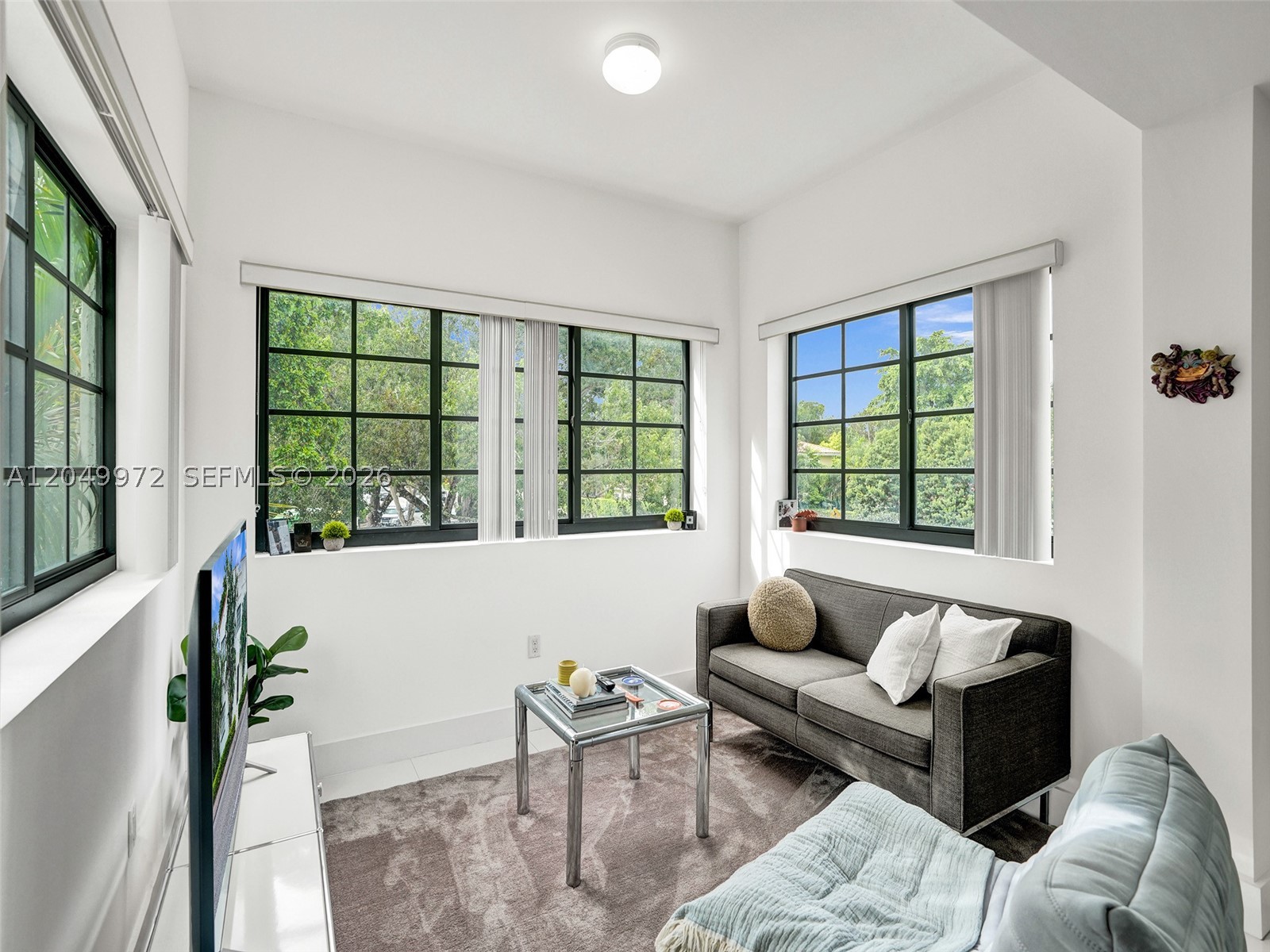 Spacious and bright 2-bedroom, 1-bathroom remodeled apartment, filled with natural light, in a boutique building just blocks from Miracle Mile and the best cafes, restaurants, and shops of Coral Gables. This bright 2nd-floor residence offers lush greenery views from every window. Features include ceramic tile floors, stainless steel appliances, soundproof windows, and a sleek new bathroom with glass and stone finishes. In-unit washer/dryer, separate water and electric meters, and private assigned parking. Pet-friendly. Two blocks from the award-winning Bachour bakery and cafe, and a block from Target. Enjoy safety and tranquility, minutes from the Gables' most exciting lifestyle and a quick drive to Brickell, University of Miami, and the airport.