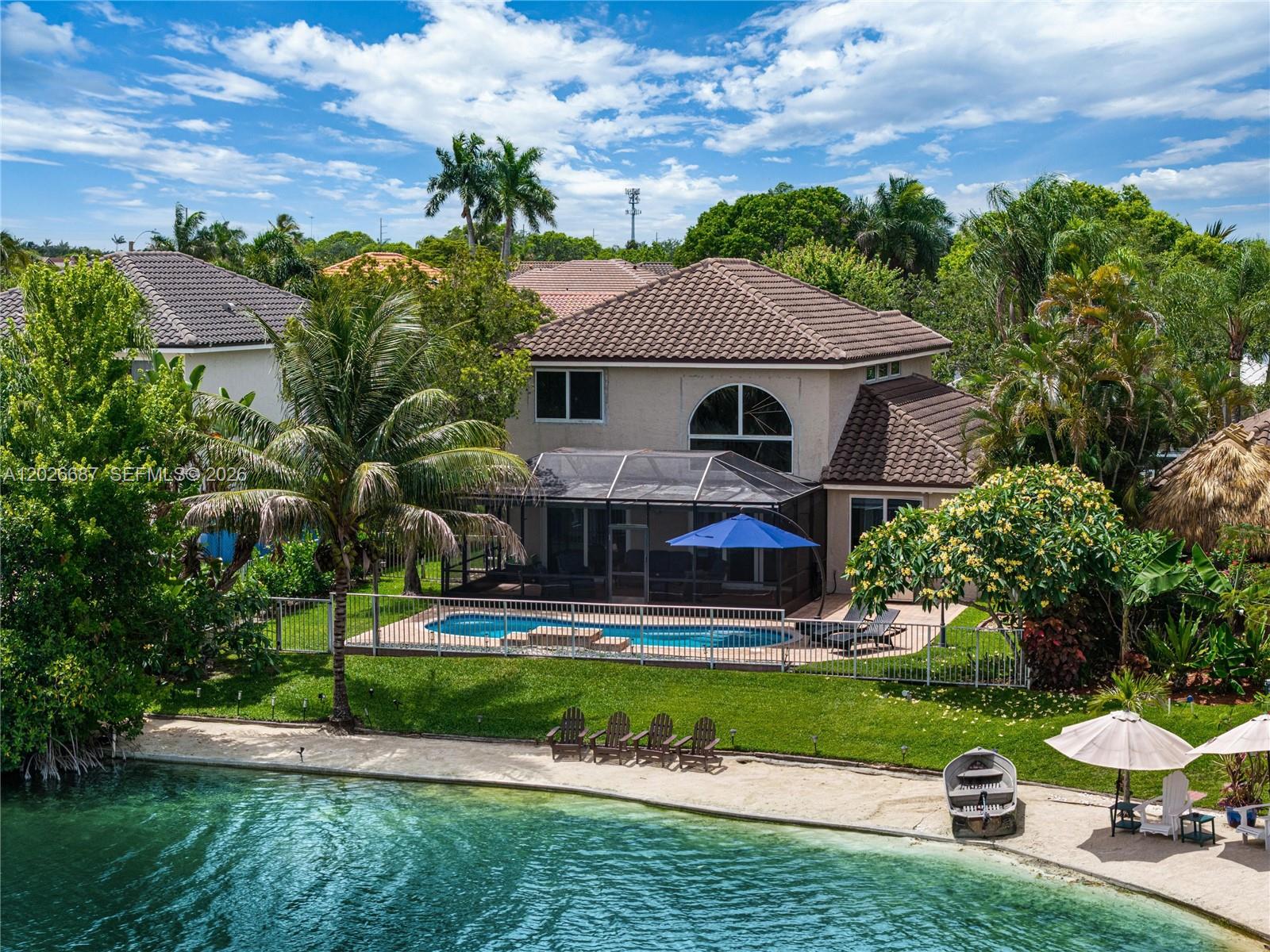 Most lake homes give you a view. This one gives you a beach + $300k of upgrades. A rare private sand shoreline on your own lake makes this one of the most unique waterfront properties in all of West Pembroke Pines. Spend your mornings on the covered patio watching the water, then take a walk on the miles of trails Chapel Trail is known for. This neighborhood sells itself.

Inside, 2,309 square feet of completely reimagined living space across 4 bedrooms and 2.5 baths. The primary suite is on the ground floor, a layout that is genuinely hard to find at this price point. Everything you see has been touched. New tile and baseboards downstairs, fresh carpet upstairs, fully remodeled kitchen, all new bathrooms, custom vanity and designer shower in the primary. Stone accent wall adds a detail you just do not see in homes at this price.

New roof (2023), impact doors and windows, updated plumbing and electrical, stainless steel appliances under two years old. The pool was resurfaced in 2024 with new tile and the heater is still under warranty. A separate laundry room and a two-car garage round out a home that functions as well as it looks. HOA is $169/month and includes cable/internet.

Top-rated schools, including one of Broward's best high schools, are right in the district. Turnkey, waterfront, with a sand beach in your backyard. Contact us to set up your private showing.
Pace loan reflected on Tax roll, this will be paid by Seller.