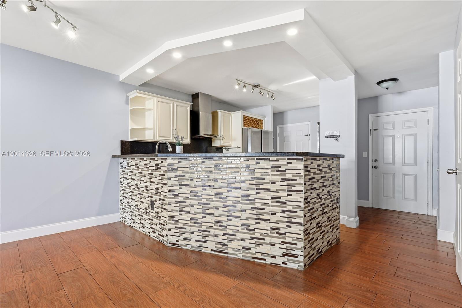 Discover this beautifully renovated and spacious 2-bed, 2-bath move-in ready apartment with an oversized balcony overlooking a serene lake with good natural lighting today's buyers crave in a fantastic location. Blending a comfortable and modern style, with good closet space and plenty of features:  stunning wood-look ceramic floors throughout for low-maintenance, fully painted 1 year ago, smart thermostat, Rheem A/C just serviced. The open updated kitchen and spa-like bathrooms were updated 3 years ago, and an added storage detached. Jade Winds has 24/7 guarded gate security, community pools, and undergoing updates and improvements. Exterior building was painted in 2025. 

Located just minutes from the world-class shopping at Aventura Mall, top-tier dining, conveniences, major highways, close to Hard Rock Stadium under 7 miles, and just under 5 miles to the beaches. This apartment offers unbeatable value in a prime location to buy and hold.

Updated, stylish, and move-in ready. Schedule your private tour today and see why this is the best deal in 33179!