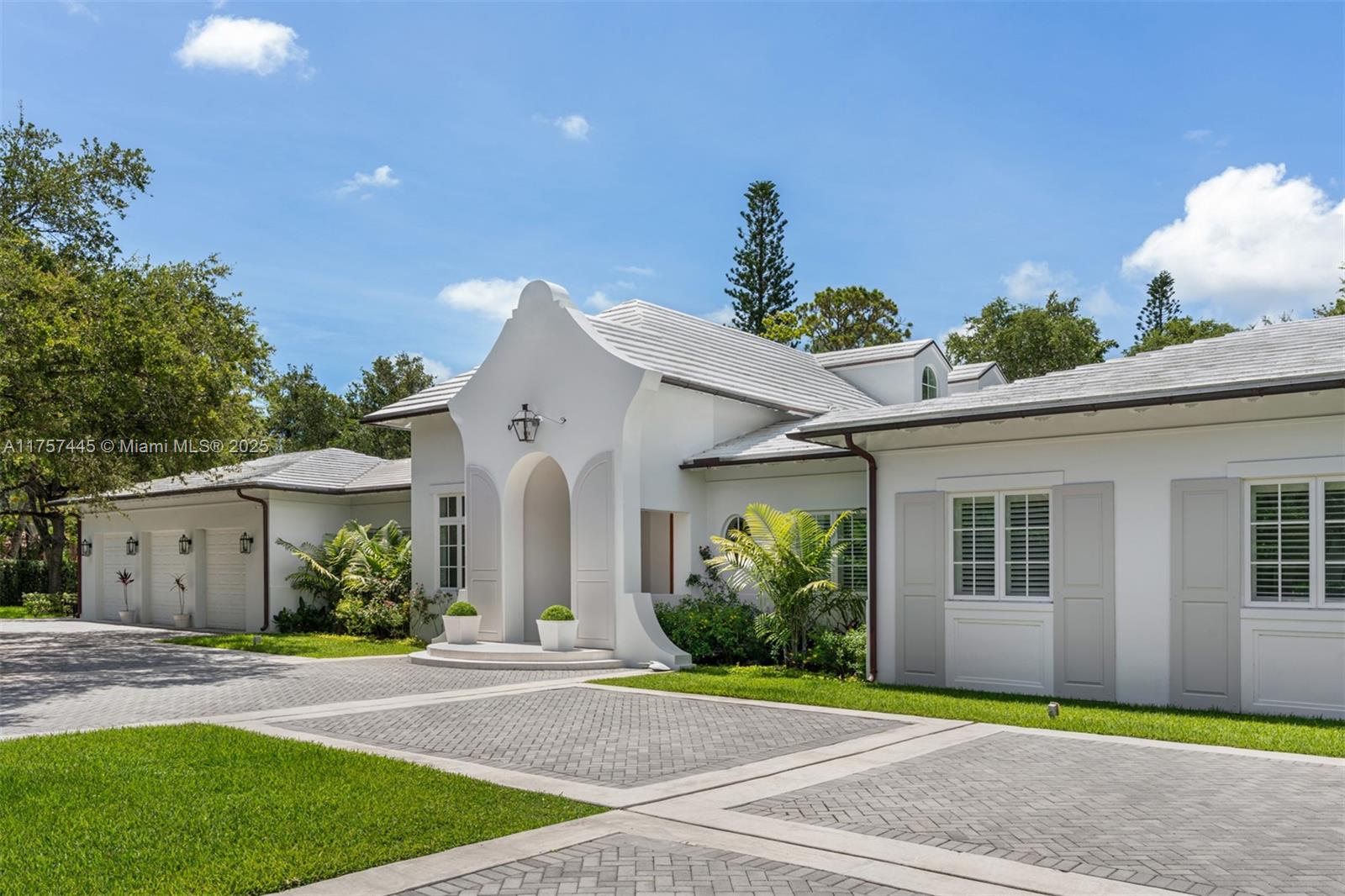 Nestled behind a private gated entrance in the heart of Pinecrest, this breathtaking estate exudes elegance and modern sophistication. With 5 bedrooms & 5.5 bathrooms, this home welcomes you with soaring vaulted ceilings, & a spacious great room that seamlessly integrates the living areas & kitchen into a beautifully open layout. The chef’s kitchen is equipped with a Lacanche Citeaux French range, dual Sub-Zero refrigerators, 2 Miele dishwashers, & a dedicated bottle wine storage room. The primary ste features a cozy sitting area, a custom walk-in closets, & a spa-like bathroom with dual sinks, a soaking tub, & a walk-in shower. Step outside to a lush backyard oasis, where a covered terrace with ambient lighting, a comfortable sitting area, a summer kitchen, & a sparkling pool.