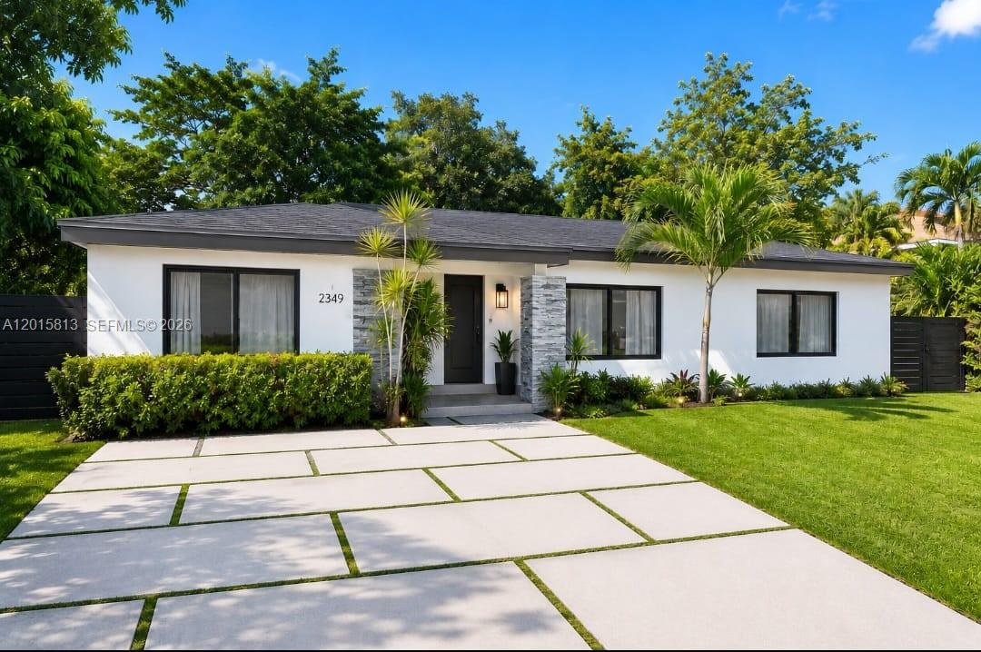 Fully updated and move-in ready home situated on an oversized 9,050 SF gated lot! This spacious property features a new roof, new hurricane impact windows and doors, new concrete and tile driveway with parking for 4 cars, and beautifully updated bathrooms with new toilets and modern finishes. Tile flooring throughout the entire home. Open and functional layout with abundant natural light. Large backyard with plenty of room for entertaining, pool, or future expansion. Zoning allows for construction of a second floor, offering excellent future value and investment potential. Conveniently located near Aventura, beaches, shopping, restaurants, and major highways. The home currently generating over $7,000 per month in rental income.