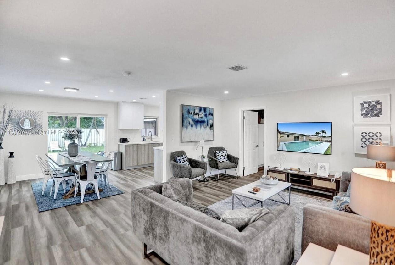 BEAUTIFULLY FULLY REMODELED 4 BEDROOMS 2 BATHROOMS + DEN HOME WITH LARGE POOL IN THE HEART OF CORAL RIDGE- FORT LAUDERDALE! PERFECT TURN-KEY HOME OR VACATION RENTAL OPPORTUNITY! HOME FEATURES, HIGH IMPACT WINDOWS AND DOORS, BRAND NEW BATHROOMS, BRAND NEW WASHER AND DRYER, 2016 A/C UNIT, IRRIGATION SYSTEM WITH NEW GRASS AND PLANS IN THE FRONT. 2017 40 GALLONS WATER HEATER TANK, NEW CUSTOM KITCHEN WITH HIGH-END EUROPEAN CABINETS, QUARTZ COUNTERTOP WITH BRAND NEW 2022 STAINLESS STEEL APPLIANCES, RECESSED LIGHTING THROUGHOUT, BUILD-IN CABINETS IN THE BEDROOMS, VERY LARGE BACKYARD WITH A POOL, CIRCULAR SPACIOUS DRIVEWAY, FRESHLY PAINTED INSIDE/OUT... MINUTES FROM SCHOOLS, BEACH, SHOPPING PLAZAS ETC... HURRY THIS WON'T LAST LONG!!