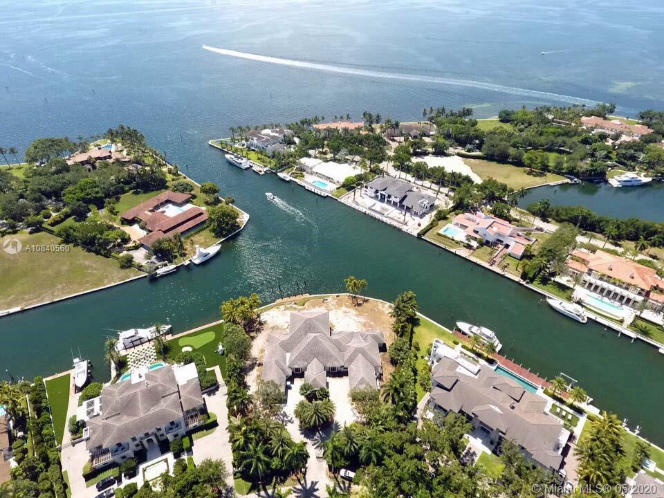 Advantageously sited Gables Estates parcel boasts 270 waterfront feet along a sweeping 180° arc showcasing lagoon & open bay panoramas. Dock a mega yacht & still enjoy unimpeded views. Approved plans for a Cesar Molina-designed Tropical Modern Florida residence (renderings depicted), featuring 12,868 Adj SF, 7 bdrms, 8 baths, 2 half baths, dovetail seamlessly w/the existing poured footprint & structure. Molina’s esteemed firm is renowned for its regionally appropriate organic architecture, deftly integrating local materials w/contemporary technology. Gables Estates, established in the 1960s by distinguished industrialist Arthur Vining Davis, offers the elite buyer privacy & gated security in an unparalleled South Florida setting. Just a few hundred yards to wide-open water. Paradise found!