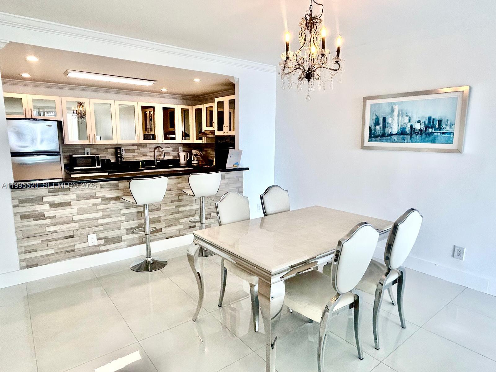 Renovated beautiful 1 bedroom plus den and 1 bathroom apartment in exclusive Sunny Isles Beach. Kitchen with stainless steel appliances open to a spacious dining/liviing room area with amazing views to the beach and Sunny Isles skyline. Short rentals allowed, good investment as a second home vacation and renting it the rest of the time, covering all expenses and getting extra income. The 2 bedroom has been converted with all city permits, hurricane proof balcony doors & bedroom window. Great building with a well equipped gym, swimming pool, picnic area & a convenience market store. Unit comes with assigned parking space. Just steps from the beach & short distance from Sunny Isles shoppes & Aventura Mall.