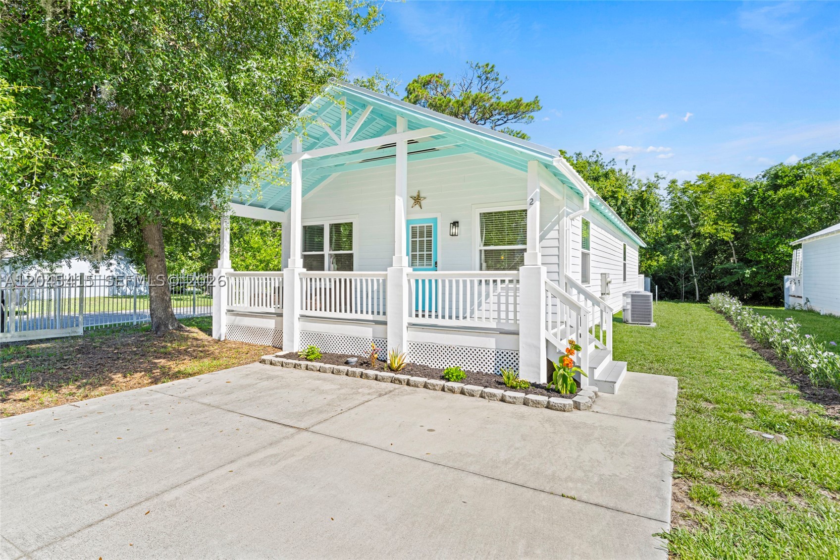 Discover the perfect blend of coastal charm and flexibility in this pristine beach house in historic St. Augustine. Currently enjoyed as an occasional short-term rental, this property is ideal as a primary residence, vacation retreat or income-producing opportunity. The turnkey furniture package makes moving in or starting a rental effortless.

Inside, the bright open-concept design features a kitchen with stainless steel appliances flowing seamlessly into a spacious living area with soaring vaulted ceilings. The main-level primary suite offers abundant natural light and private access to the newly refinished deck through sliding glass doors. The split-bedroom floor plan includes two additional bedrooms and a full bath with a tub/shower combination. The HVAC system was recently replaced and the water heater is less than three years old.

Relax on the newly refinished covered front porch overlooking tranquil views. Nestled in a marsh-side cove just minutes from historic downtown St. Augustine, Fort Mose, beaches, shopping and dining. This home offers the perfect blend of convenience and coastal living. Schedule your private tour today!