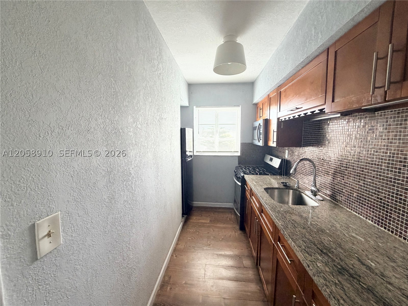 2-bedroom, 1-bath residence in the heart of Miami Beach, featuring a sleek, modern design and an abundance of natural light. This move-in-ready home has been freshly painted and offers a bright, inviting living space. The kitchen is equipped with stainless steel appliances, ample cabinetry, and generous counter space, while the bathroom has been tastefully renovated with contemporary finishes. Ideally located just a short stroll from the beach and moments from Miami Beach’s renowned dining, shopping, and entertainment, this home offers the perfect blend of style, comfort, and convenience—making it an excellent choice for a primary residence, vacation home, or investment opportunity.