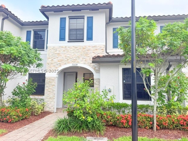 Priced to sell! Beautiful 2019-built townhouse in the desirable Isola at Coco Palm Villas community. This well-maintained 2-story residence features 3 bedrooms, 2.5 bathrooms, and 1,488 SF of living space. Enjoy an open-concept living and dining area with tile flooring on the first level and laminate wood flooring upstairs. The kitchen offers white cabinetry, granite countertops, and stainless-steel appliances. Additional features include a spacious laundry room with washer and dryer, electronic door lock, covered entry, and two assigned parking spaces directly in front of the unit. Residents enjoy access to resort-style amenities including a fitness center, spa, pool, playground, dog park, and 24-hour gated security. Low HOA fee covers outside lawn maintenance and common areas. Conveniently located near major highways, shopping, dining, schools, and the Florida Keys. Excellent opportunity for homeowners or investors seeking value in a growing Homestead market.