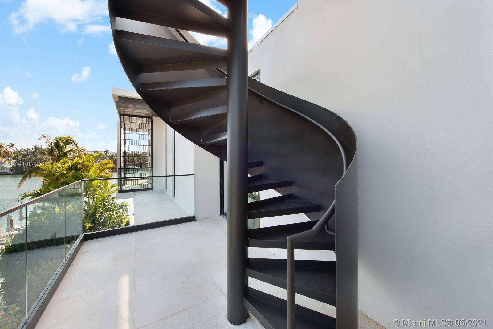 Stunning new contemporary luxury waterfront villa on the coveted Hibiscus Island. Designed by Borges Architecture & Designer, Tara Nia, you’ll enjoy beautiful 360-Degrees views of the iconic Miami skyline. This fully custom, awe-inspiring, smart home features an Ornare kitchen, sleek entertainment bar, floor-to-ceiling wine cellar. A floating sculpture staircase takes you to the spacious master bedroom and marble bathroom with unique Mia Cucina 'His & Hers' closets. Gorgeous contrast of wood, concrete, and stone elements provides a tropical warmth and calmness. Other amenities include floor-to-ceiling sliding doors, rooftop terrace, infinity pool, 2-car collectors garage, commercial grade elevator, and more!