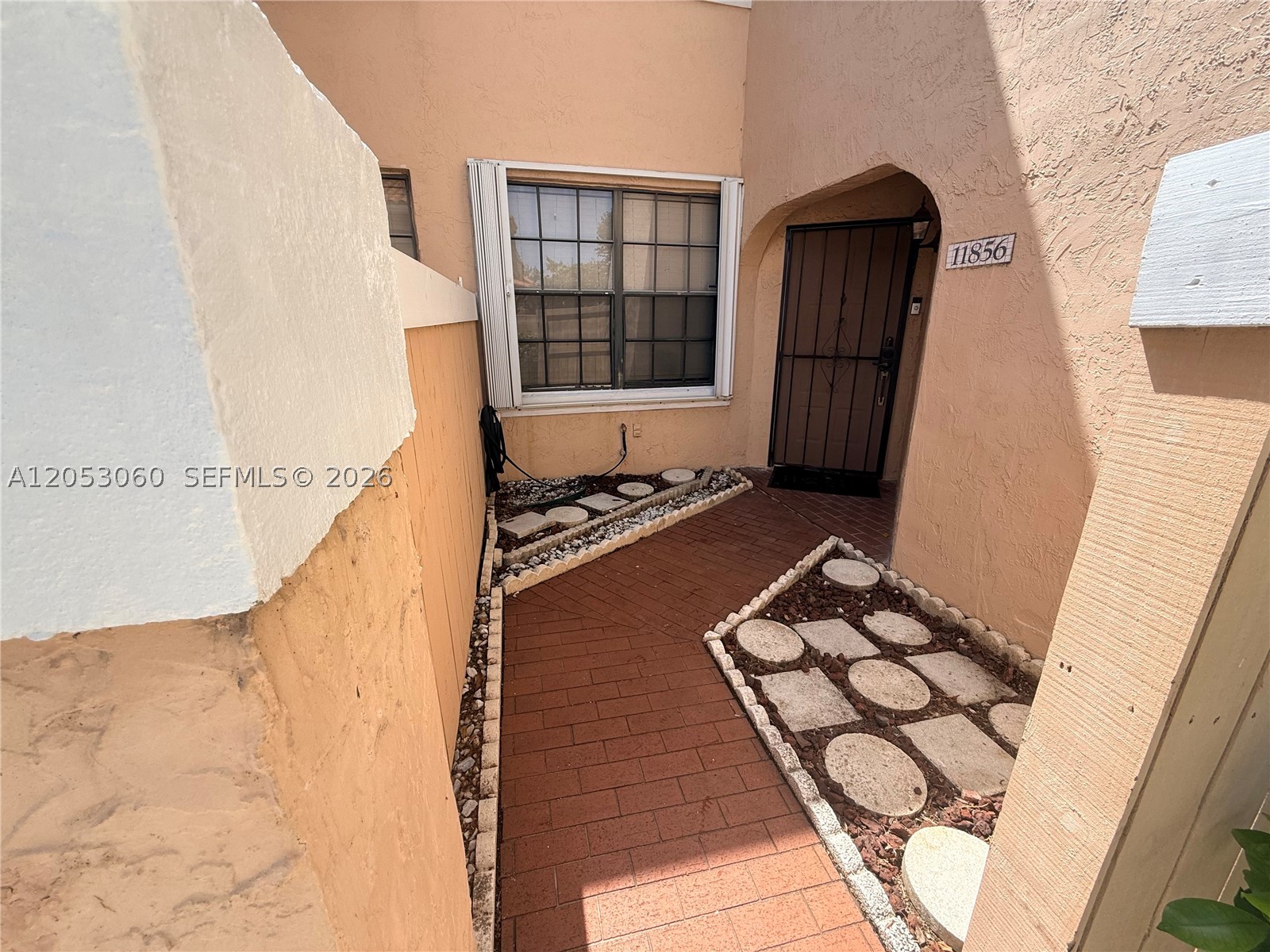 Welcome to this beautifully maintained corner residence with the convenience of first floor living with no stairs to climb! This spacious 3 bedroom, 2 bathroom home features a bright, open floor plan with a beautifully updated kitchen, stainless steel appliances, ample cabinet and counter space, and a seamless flow into the living and dining areas, creating the perfect space for everyday living and entertaining. The oversized primary suite offers generous closet space and a private ensuite bath, while two additional bedrooms and a second full bathroom provide comfort and flexibility for family, guests, or a home office. Enjoy the convenience of a separate laundry room, an additional interior storage room, and a private screened patio perfect for relaxing with your morning coffee or unwinding at the end of the day. Recent updates include new A/C, appliances replaced in 2020, refrigerator replaced in 2025. Complete accordion hurricane shutters and a storm door provide added protection and peace of mind. Ideally located in the gated community of Pierpointe, residents enjoy beautifully maintained grounds, a community pool, and a prime Pembroke Pines location close to shopping, dining, parks, top rated schools, and major highways. HOA includes water, trash, exterior maintenance, and community amenities, making this move in ready home the perfect combination of space, style, comfort, and convenience.