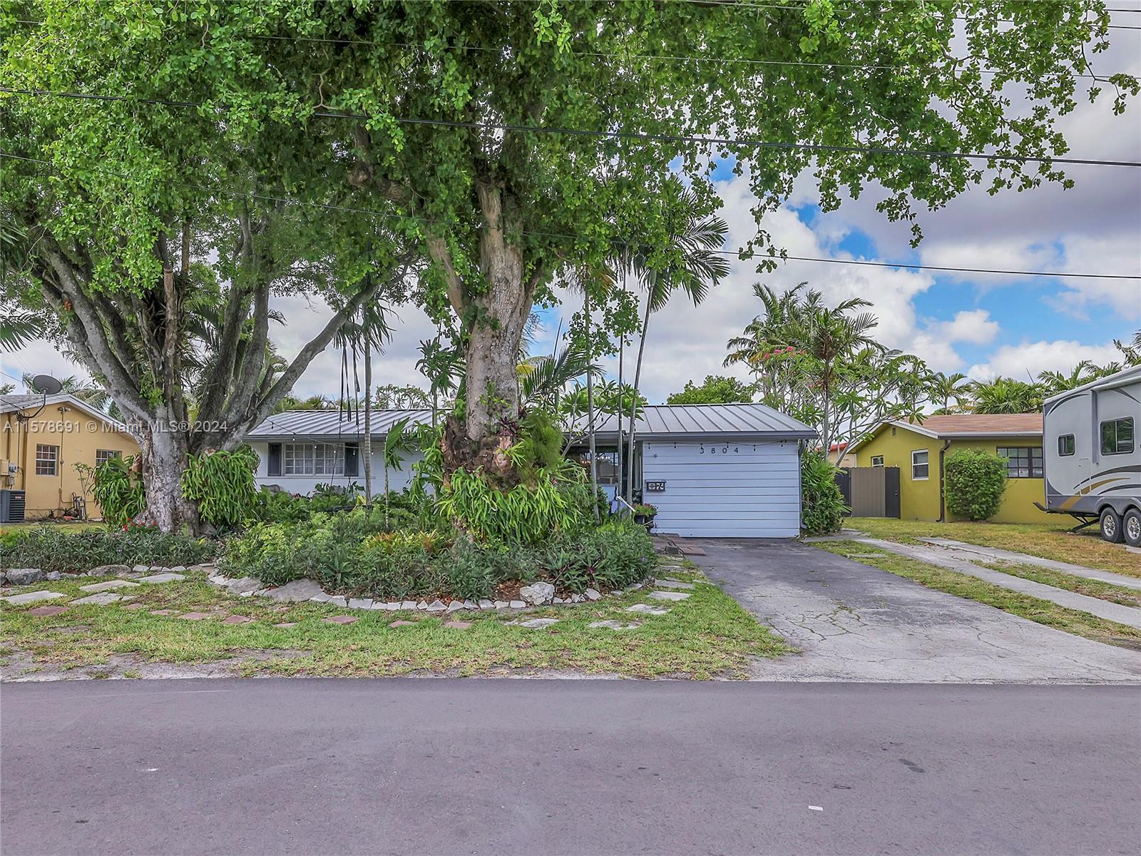 Spacious layout with large living room, dining room, and family room. Backyard is like an oasis with beautiful landscaping and relaxing water view. Separate laundry room and storage. . All bedrooms are a nice size. Metal Roof is 2020, AC 2018, Water heater 2024. White Shaker style cabinets with white quartz counters.
