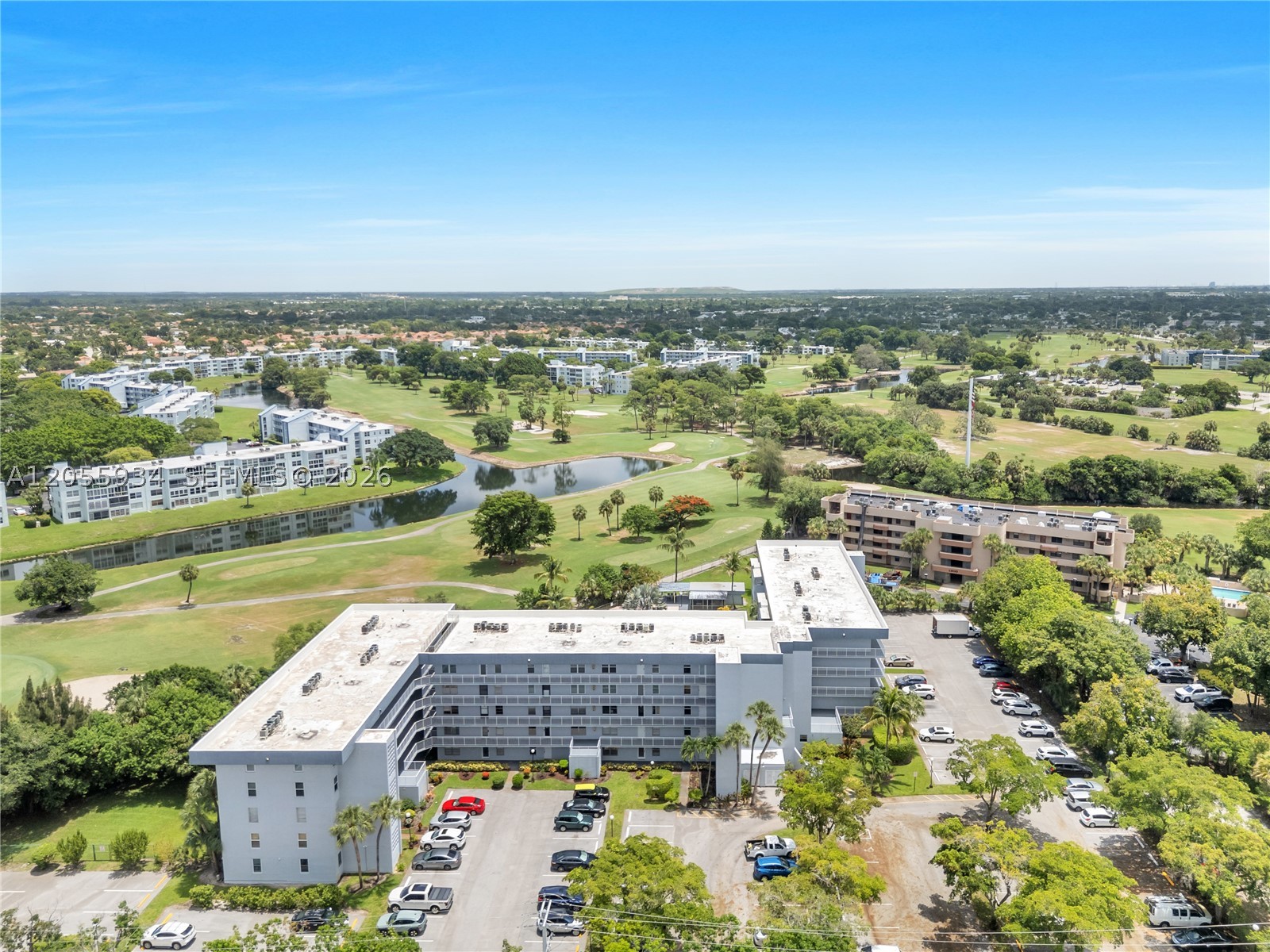Come and see this beautiful, immaculate and move in ready 2/2, 3rd floor condo with peaceful Golf Course and Pool views today! You will feel like you are home the minute you walk through the front door! Don't miss an amazing opportunity to own this light and bright condo in the 55+ Continental Village, that boasts a one of a kind boutique building, in the Palm Springs community! You will love the serene and tranquil views over-looking the pool area and out to the 3rd hole of the Oriole Golf Course! Enjoy the added protection from the floor to ceiling impact windows in sunroom and new windows in bedrooms and kitchen. Other features include: Brand new AC July 2026, Larson retractable screen storm door, luxury vinyl (waterproof) flooring in great room, kitchen and guest bathroom, updated guest bathroom and new walk in shower, extra storage closet in hall and guest bedroom with shelving, marble look tile floors in master and guest bedrooms, updated kitchen cabinets, stainless steel kitchen sink, refrigerator & stove, Bosc dishwasher, pantry, all updated louver closet doors, updated lighting in dining room, hall and guest bathroom. Master suite is updated and boasts a huge walk-in closet. For added convenience, you have a storage closet inside the unit off for easy access when needed. Unit is close to laundry room, elevators & trash chute. Parking spot right out front. Maintenance includes: cable, water/trash, insurance, pest control, lawn, roof, building exterior & common areas.