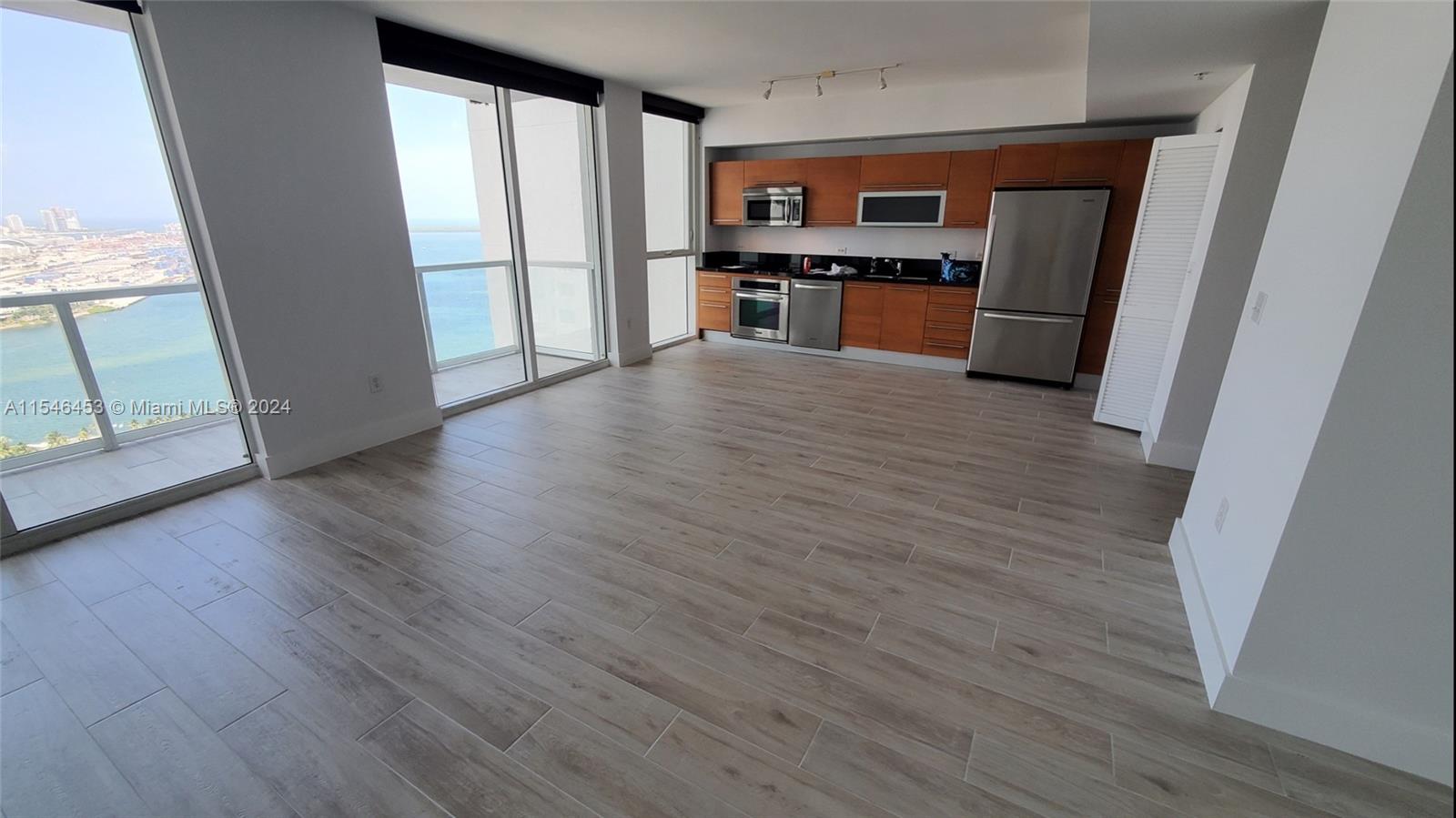 Just reduced! One of the few exclusive studios facing the water from a high floor. Unobstructed views are absolutely breathtaking day & night! This side of the building does NOT face any construction site. Open bright & spacious floorplan with 632SqFt. Great appliances, long balcony and large washer/dryer in unit. Flooring was upgraded to beautiful modern ceramic. 1 assigned covered parking space plus 1 storage unit. Building has 5-star amenities including 4 pools, hot tub, spa, jacuzzi, sauna, theater, event room and business center. Amazing location in front of Bayfront park. 2 metro-mover stations on each side of the building. Great landlords. Long term lease only. No pets.