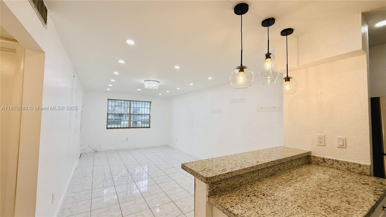 Beautiful ground-floor condo of 615 sq ft, fully remodeled and move-in ready. Located in a secured gated community with private parking and a sparkling community pool. This bright 1-bedroom, 1-bathroom unit features new flooring, new laundry in site and elegant ceiling lamps. The spacious living area opens to a screened balcony, perfect for relaxing. No pets and no leasing allowed, ensuring a quiet and stable environment. With its stylish upgrades and excellent location, this condo is a perfect investment for a first home.