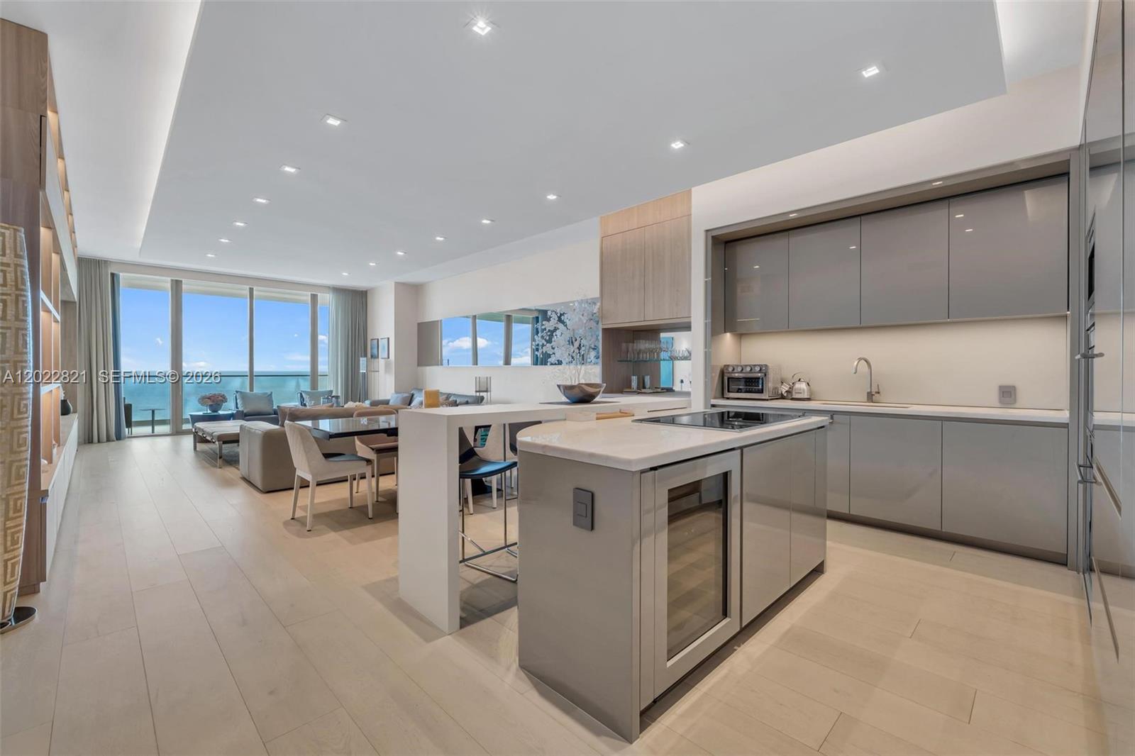 Fully furnished residence at Residences by Armani/Casa offering expansive ocean and skyline views, private terraces, and a thoughtfully designed layout featuring 4 bedrooms plus den, 5.5 bathrooms, and staff quarters with private bath. The residence showcases floor-to-ceiling glass, custom walk-in closets, spa-inspired bathrooms, an open living and dining area, and a contemporary kitchen equipped with premium built-in appliances, custom cabinetry, and oversized island seating. The spacious primary suite includes direct water views, generous storage, and a luxurious bath with soaking tub and separate shower. Additional features include a separate laundry room and flexible den/media space ideal for work or relaxation. Residents enjoy private elevator access, approximately 35,000 SF of resort-style amenities, oceanfront pools, beach service, wellness and fitness facilities, concierge, valet, resident lounges, spa experiences, and additional full-service conveniences within one of Sunny Isles Beach’s premier oceanfront communities. Owner prefers a 6-month lease term; however, alternative lease durations may be considered subject to owner approval and lease terms. Availability and pricing may vary based on season and length of stay.