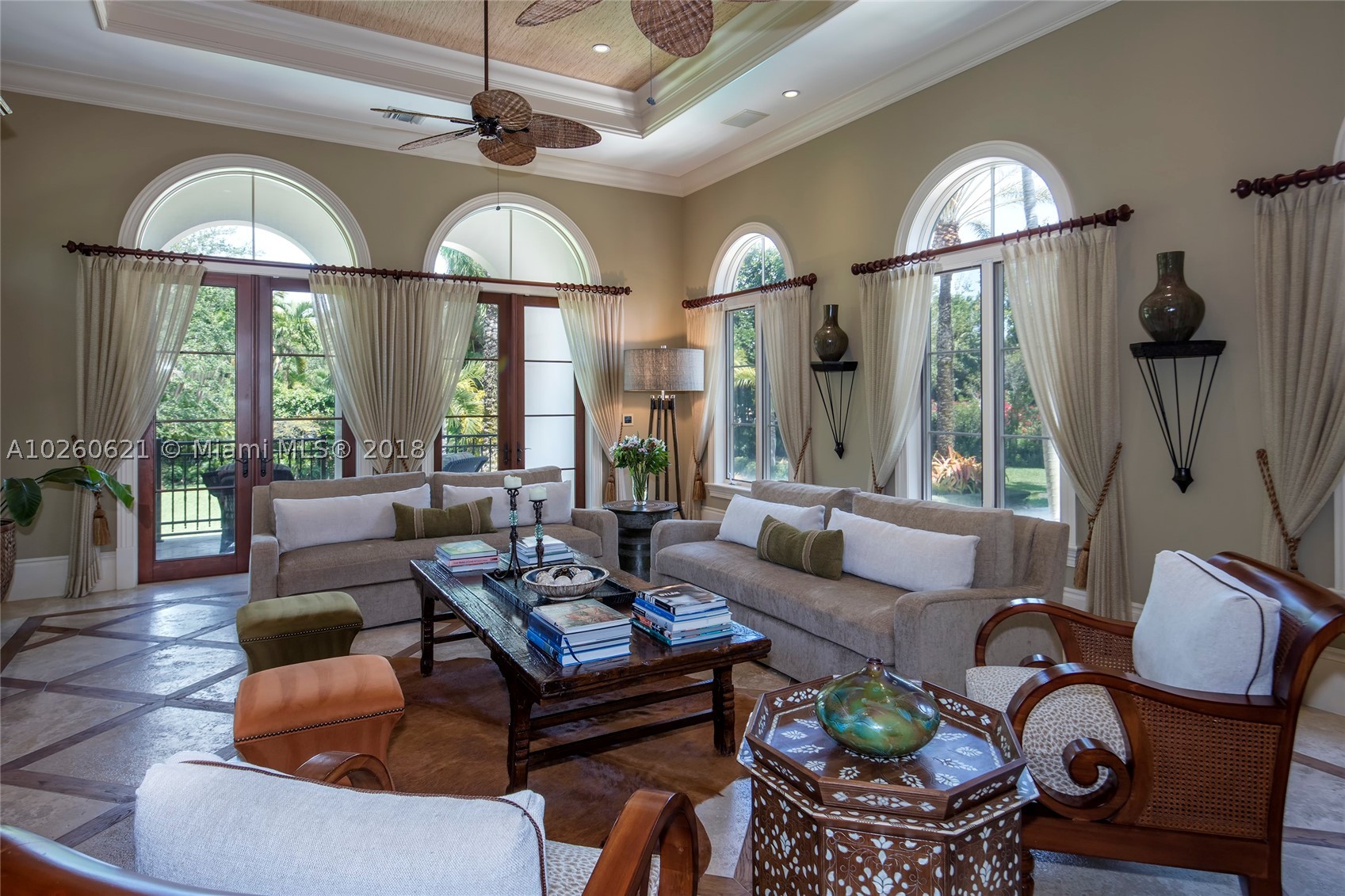 Stunning Mediterranean gem designed by Ramon Pacheco on gated beautifully landscaped 36,750 sf lot. Circular driveway,grand front entrance w/arched mahogany doors.Foyer,formal living & dining rm have high ceilings. Elegant custom finishes throughout:mahogany millwork, Roatan wood drs,built-ins,marble & wood flrs.The spacious kitchen has Sub Zero/Wolf appliances, large island,walk-in pantry. Breakfast area opens to family rm overlooking garden,pool area & covered terrace. Large sitting rm opening to master suite on a split level w/2 generous walk-ins, elegant new bathroom & private covered terr.Bedrooms wing has 3 addl en-suites.The pool deck & large yard feature a covered summer kitchen,built-in bar,full cabana bath.Separate staff quarters.SqFt is ADJ area as per owner.