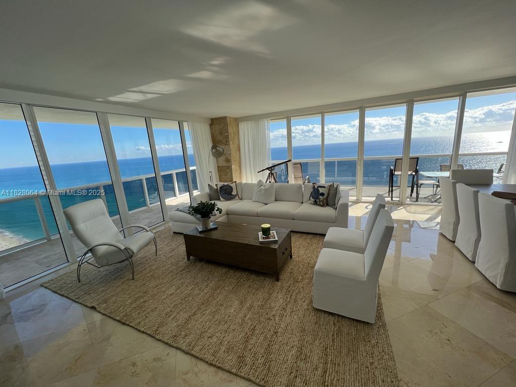 Breathtaking direct ocean and skyline views from every room or from your 586 Sq. Ft. wraparound balcony. This
stunning oceanfront 2 bedroom plus den and 3 full bathrooms corner unit with North East exposure has everything
you need. Features luxury finishes such as European kitchen, granite countertops, state of the art appliances, built-
in closets and marble floors throughout. Enjoy the views from floor to ceiling high impact windows with sliding
glass doors. Fully Furnished. The Beach Club offers concierge service, valet parking, beach service, 6 pools, bar
and restaurant service, and ultra-luxury 50,000 sq. ft. spa and ocean front fitness center. Perfectly located near
Gulfstream Park and the Hollywood boardwalk, Bal Harbour, South Beach