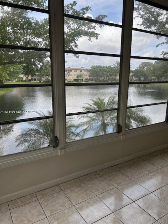 Discover comfort in this cozy 2BD/2BA condo, perfectly situated in a 55+ community. This move-in-ready home features complete impact doors and windows for maximum safety and energy efficiency. Enjoy serene mornings with a beautiful lake view right from your living space. The community offers a clubhouse, community pool, and BBQ areas perfect for socializing. Unbeatable location—just minutes from hospitals, major supermarkets, and dining. Experience the best of South Florida living in this quiet, and peaceful condo apartment
