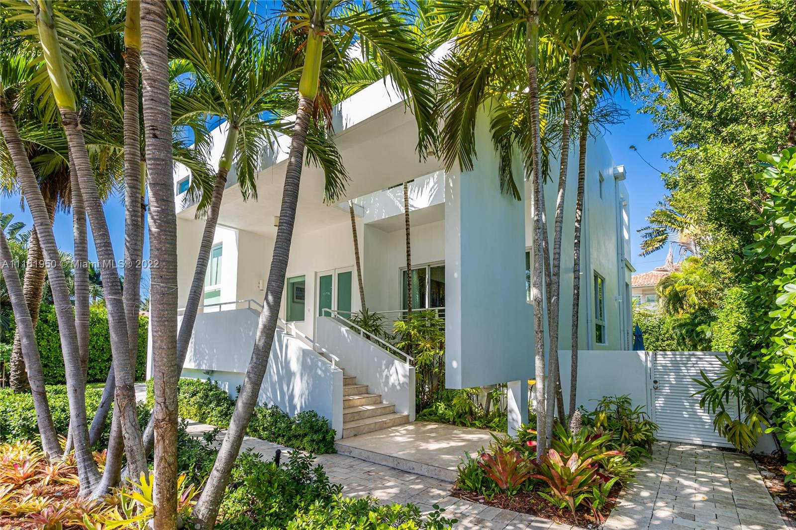 Beautiful modern home located in the heart of Key Biscayne just steps away from Harbor Drive and brand new Harbor Park. The property features 5 bedroom and 5.5 bathrooms. Very spacious and bright, ample living area overlooking a covered terrace on the pool. The large kitchen opens to a big dining area facing the garden that could be easily converted into a family room. Guest bedroom/home office with private bathroom located on the mezzanine. Separate home entrance from carport with lots of extra storage. On second level you will find the master suite and 3 other bedrooms with en suite bathrooms. A big terrace outside the master bedroom connects to the rooftop overlooking the key
