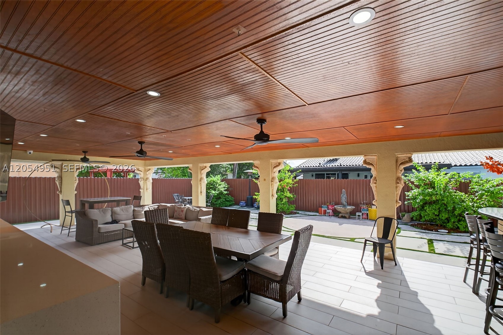 Imagine hosting unforgettable gatherings on the spectacular 1,000 sq. ft. covered terrace, designed for year-round entertaining. Complete with a summer kitchen and commercial-grade cooler, it's the perfect space for family and friends. Inside, this beautifully maintained home offers 3 bedrooms, 2.5 bathrooms, and approximately 1,909 sq. ft. of open-concept living with tile flooring throughout. The modern kitchen features stainless steel appliances, granite countertops, and ample cabinet space. Additional highlights include impact windows, a laundry room, a durable tile roof, and plenty of parking. Available for rent beginning August 15, 2026