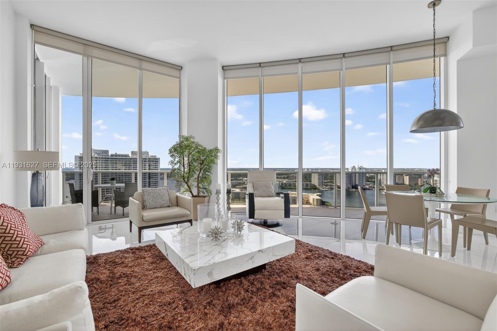 Step into luxury at your new home in Bellini! Fully updated and professionally designed 3BR/3BA with 12ft ceilings, open layout, private elevator entry, concierge. This stunning 3 bed, 3 bath residence offers 2,235 sq ft of beautifully finished space with top-of-the-line appliances, private elevator/foyer, and breathtaking views. Enjoy sunrise/sunset views via floor-to-ceiling windows throughout.  This close-knit community includes State of the Art Amenities expanding just under 30,000 sq. ft.: LIVE IN PRESTIGIOUS WILLIAMS ISLAND WITH FULL AMENITIES:  14 TENNIS COURTS, 4 PICKLE BALL COURTS, 2 PADEL COURTS, 3 RESTAURANTS, STATE OF THE ART SPA, MARINA, WALK/JOG PATH, KIDS PLAYGROUND, BASKETBALL COURT, SOCCER FIELD, PUTTING GREEN, COURTESY BUS, PLUS GOURMET SUNDRY COFFEE/GELATO SHOP, AND SO MUCH MORE....2 Dogs OK - no size limit. This is a rare opportunity to live in a luxurious, private, exclusive, amenity-rich Williams Island community. Schedule your private showing today!