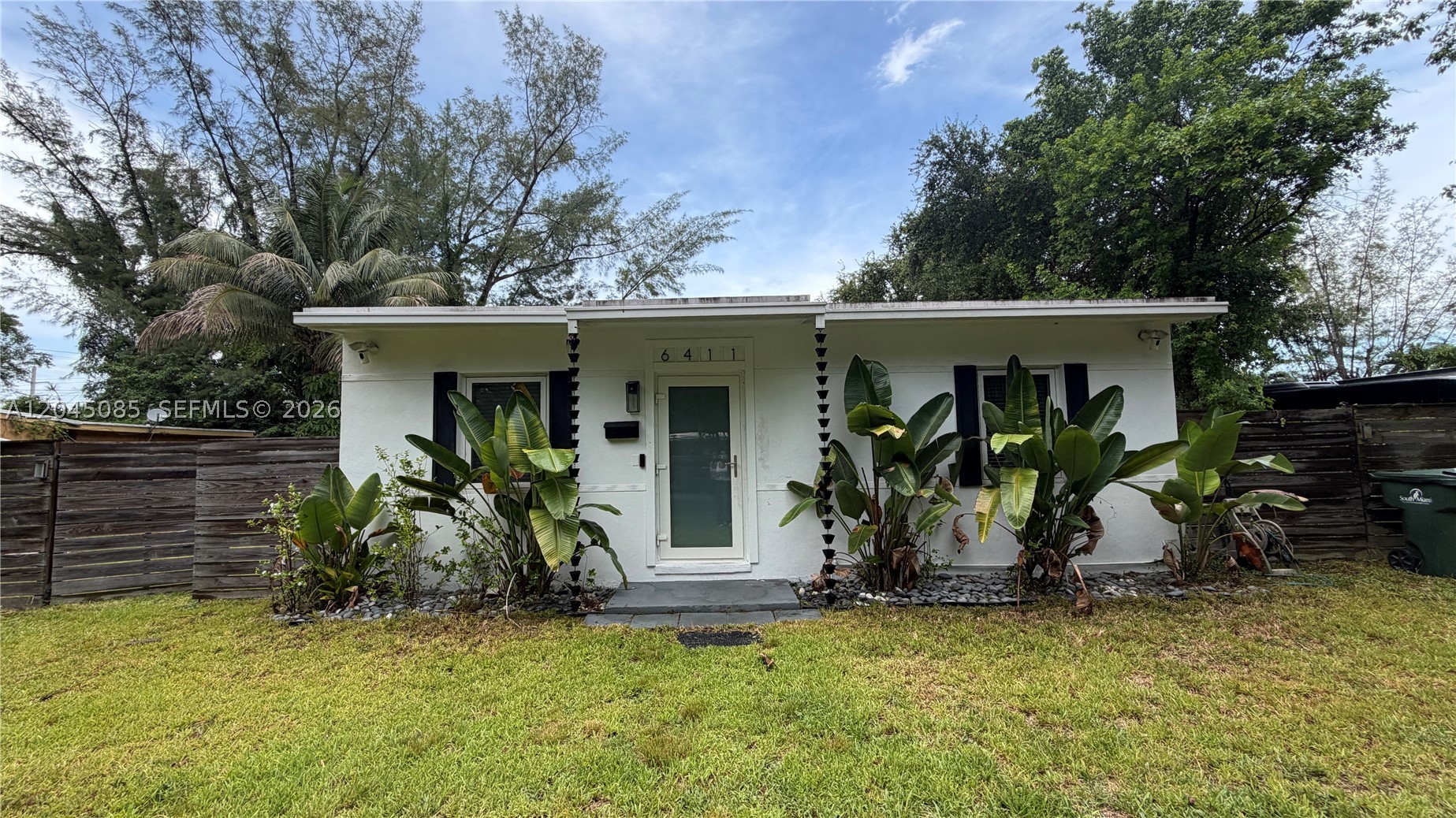 Exceptional South Miami opportunity on an oversized lot of nearly ¼ acre (approximately 10,549 SF)! This beautifully maintained home blends classic 1950s charm with modern updates, featuring vaulted ceilings, luxury vinyl flooring, impact windows and doors, an updated kitchen and bath with custom cabinetry, stainless steel appliances, PVC plumbing, and a 2020 roof with insulated beamed ceilings and recessed LED lighting. The spacious, fully fenced backyard with mature live oak trees and double-gate access offers endless possibilities for expansion or redevelopment. Move in, lease the existing home for immediate rental income, or generate cash flow while designing and permitting your dream custom residence. Ideally located just minutes from the University of Miami, Metrorail, Dadeland, hospitals, shopping, and dining. Positioned in one of South Miami's fastest-growing neighborhoods, near the exciting Sunset Place redevelopment, bringing new luxury residences, boutique retail, restaurants, entertainment, and vibrant walkable spaces, further enhancing the area's appeal and long-term value. A rare opportunity for homeowners, investors, and developers in one of Miami's most desirable locations. Build your own amazing home or develop one for sale.