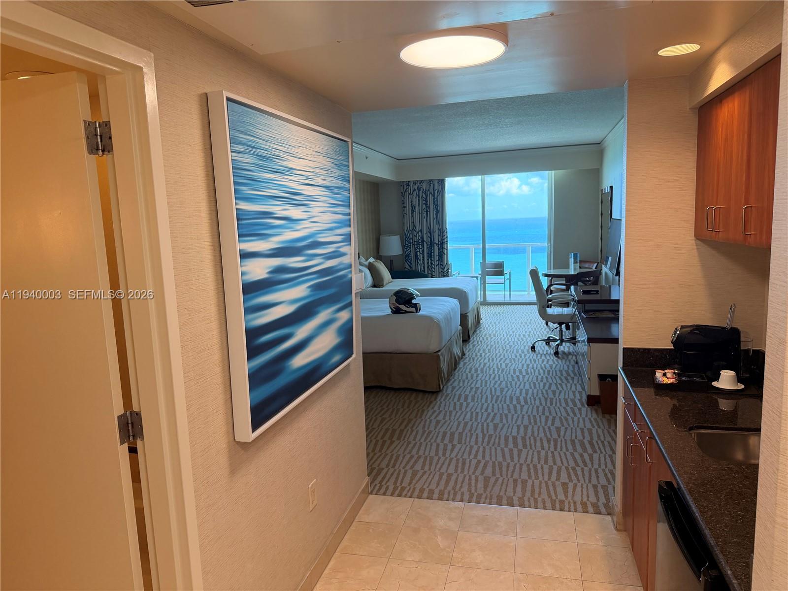 Discover the ultimate in luxury with this spacious, fully furnished deluxe studio at the Trump International Sonesta Beach Resort in Sunny Isles Beach. Perfectly positioned in the heart of the action, this beachfront paradise offers resort-style amenities just minutes from Bal Harbour Shops and Aventura Mall. Indulge in full beach and pool service, a salon, spa, gym, on-site dining, tennis courts, and a business center. The expansive balcony provides breathtaking views of the Intracoastal and city skyline, creating a serene retreat. With the option to generate income through the hotel’s rental program or other rental platforms.