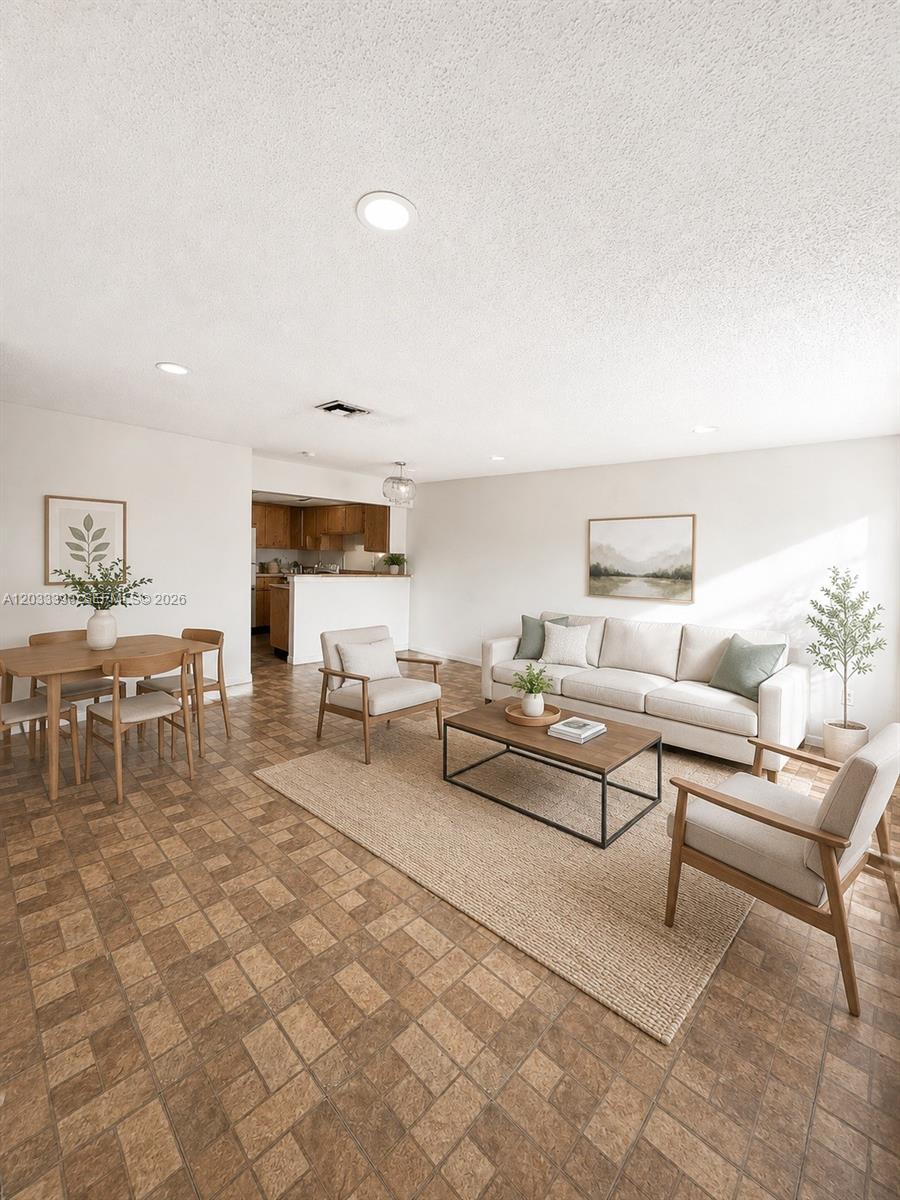 Excellent opportunity in the heart of West Kendall! Spacious 2 bedroom, 2 bathroom second-floor condo offering 1,000 SF of comfortable living space in the Lake & Tennis Villas community. This residence features tile flooring throughout, a generous living/dining area, large bedrooms, good closet space, ceiling fans, and a practical kitchen with plenty of cabinet storage and a breakfast/snack counter overlooking the main living area. Enjoy community amenities including pool, clubhouse, and common areas. Prime location near Baptist Health West Kendall, Home Depot, supermarkets, shopping centers, restaurants, parks, schools, public transportation, Kendall Dr, and the Turnpike. A great value-add opportunity for an owner-occupant or investor looking for a well-located condo with strong rental potential in one of West Kendall’s most convenient areas.