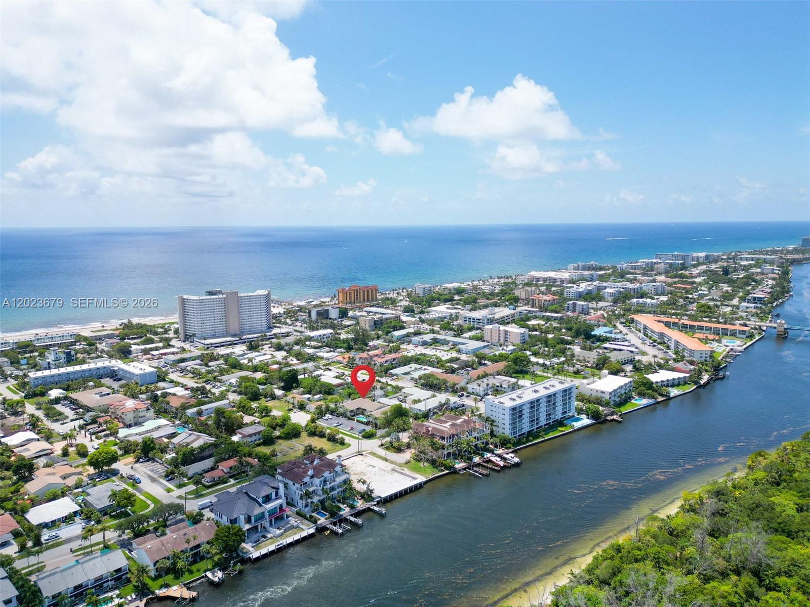 This is the one, the beach house you've been waiting for!!  Just 1.5 BLOCKS to the beach.  Perfectly located across from the intercoastal, and 5 minute walk to the beach, the pier, and all the popular restaurants.  Boutique complex of only 10 homes, and this one of only 6-- are 2 bedrooms/2.5 bathrooms.  This home is an END UNIT with a beautifully fully fenced private backyard, full of lush shrubs and flowers, truly a sanctuary!  Unit has been fully remodeled.  New roof August 2024, newer impact glass throughout.  Quartz counter tops, stainless steel appliances.  Open floor plan! Guest bathroom downstairs.  Both bedrooms upstairs have en-suite bathrooms!  Tile and laminate flooring, Built in closet systems, and an upstairs BALCONY!! Super low HOA INCLUDES INSURANCE and NOT IN A FLOOD ZONE!!!  Make this townhome your permanent or vacation home