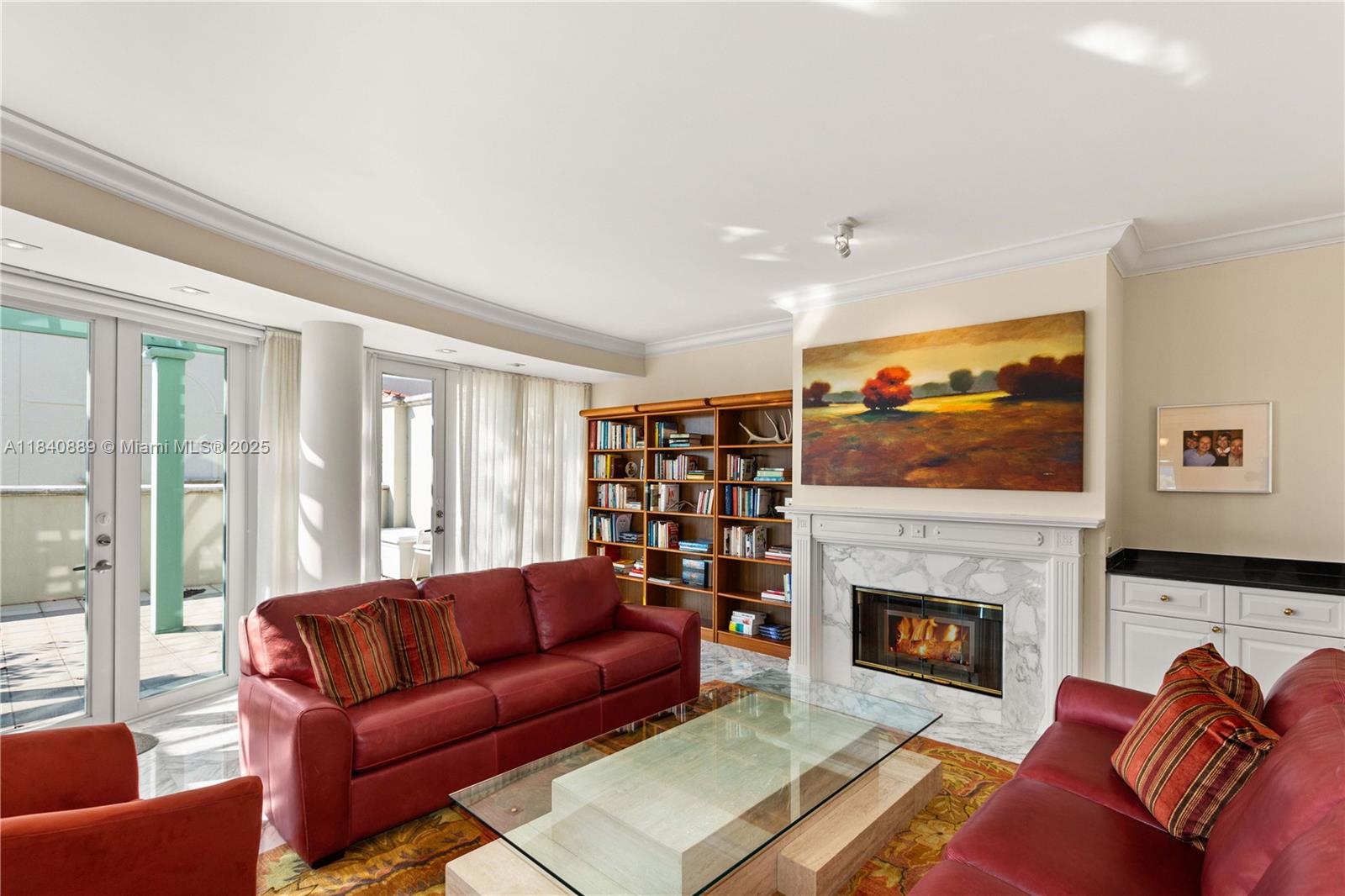 Rare opportunity and almost never available! In the heart of Coral Gables, 3-bedrooms, 2.5-bath, 2 story Condo with an internal elevator. Large veranda with trellis off living & dining area overlooking the beautiful Gables tree canopy and the Biltmore hotel. Spacious primary suite with large bathroom and closets. Two working fireplaces. One in the primary suite and one in the living room. Jack and Jill bathrooms to the order two bedrooms, marble floors, Chefs kitchen open to and overlooking the family room. Secure building with 2 parking spaces inside. This is an amazing unit with the lifestyle you get from walking to downtown Coral Gables.