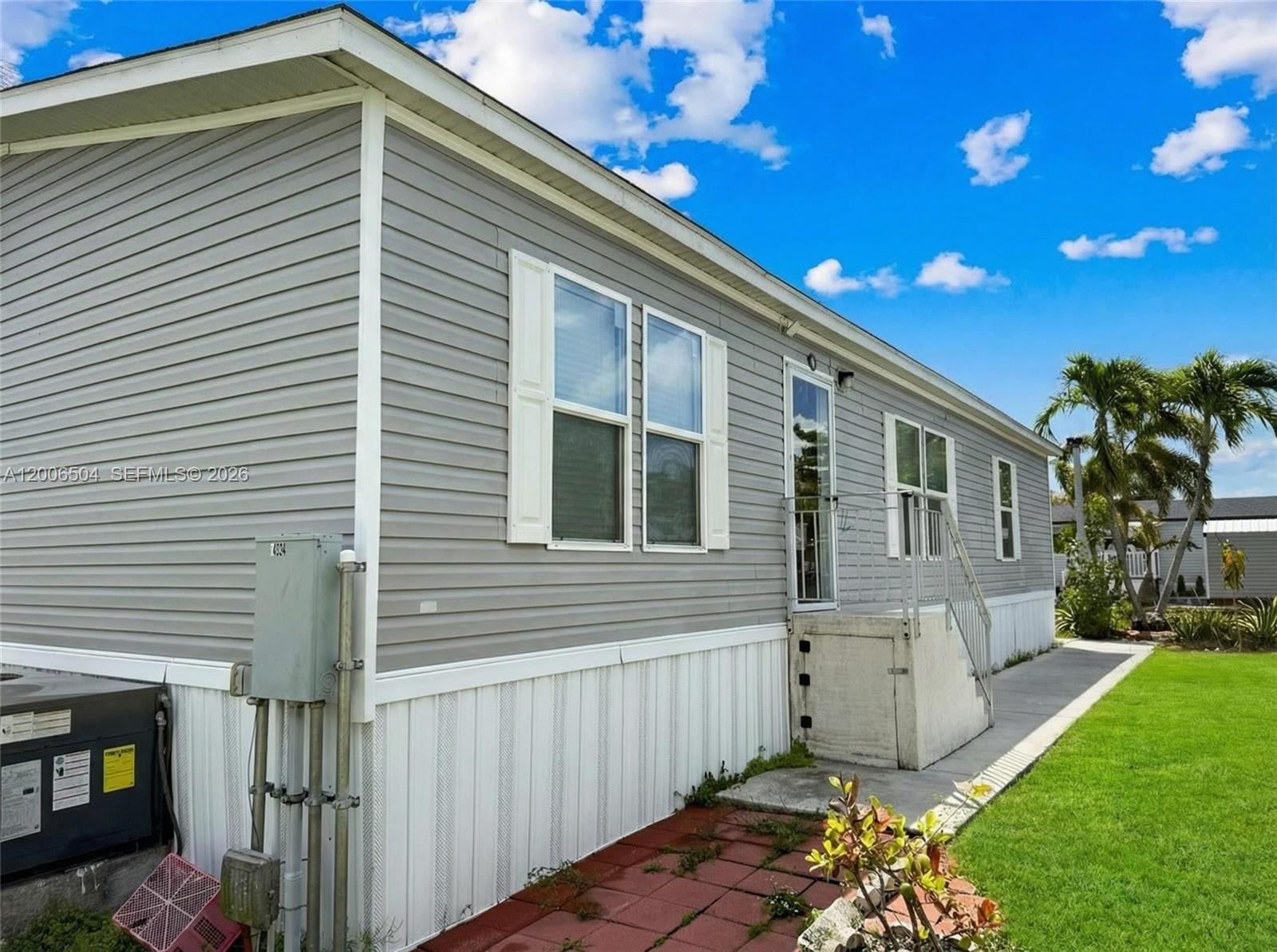 Welcome to Palm Gardens, a well-maintained and conveniently located community in South Miami-Dade. This spacious double-wide home offers a fantastic opportunity for affordable living without sacrificing comfort or space.

Situated at 25801 SW 152 Ave, Lot 158, this residence features a functional layout with generous living areas, making it ideal for both everyday living and entertaining. Whether you're a first-time buyer, downsizing, or looking for a low-maintenance lifestyle, this home checks the boxes.

Enjoy the benefits of a land lease that simplifies your monthly expenses—covering water, landscaping, waste services, common grounds, and access to recreational amenities within the community.

Palm Gardens offers a peaceful neighborhood setting while still being close to shopping, dining, and major roadways, making daily life convenient and accessible.

This is your chance to own an affordable home in a centrally located community with built-in value.

Contact for lender financing options