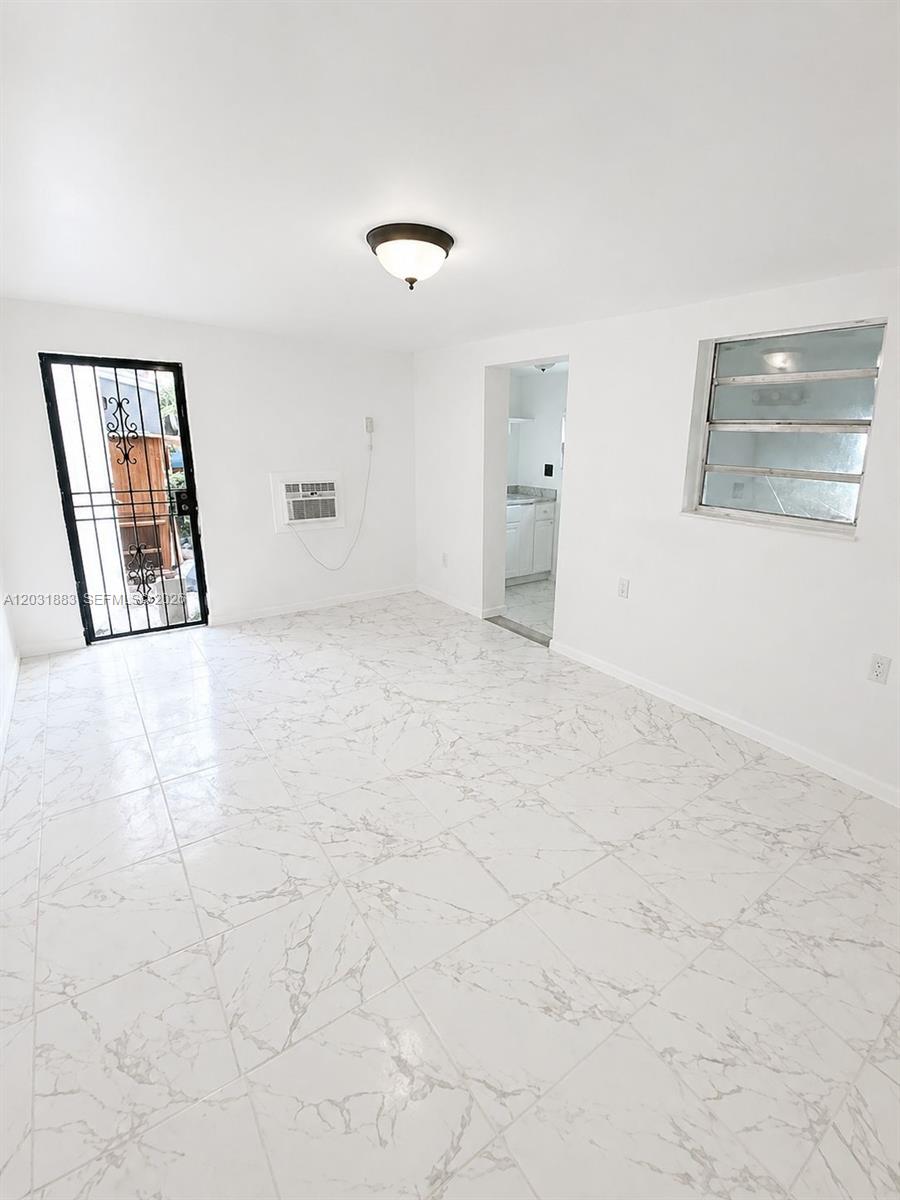 Updated efficiency with private entrance featuring modern tile floors, renovated bath, kitchenette, fresh paint, and bright open living space. Convenient Miami Gardens location near shopping, dining, major highways, and Hard Rock Stadium. Move-in ready! First month and security deposit required.