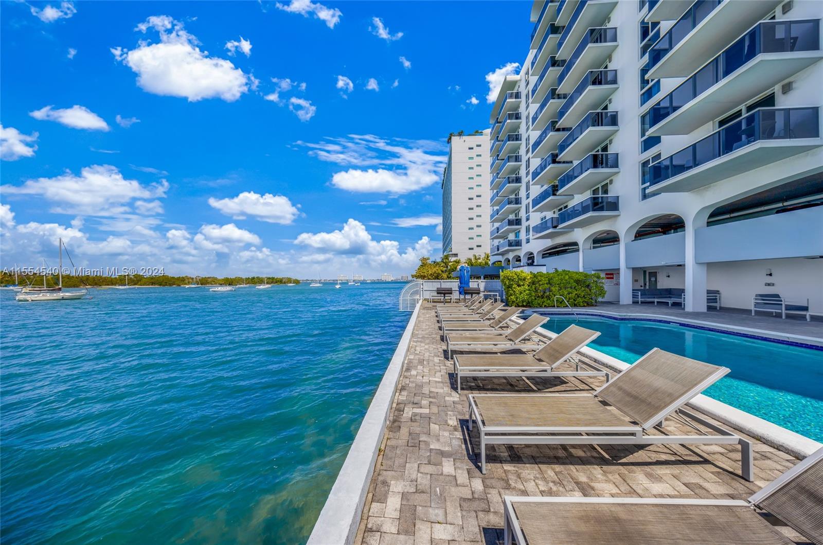 Welcome to your fully furnished, turnkey oasis with stunning views from every room! This beautifully remodeled 1 bed / 1 bath unit offers the perfect blend of modern convenience and waterfront serenity. Step inside to find tiled floors throughout with an updated kitchen boasting stainless steel appliances, granite countertops, and a convenient snack bar, perfect for casual dining or entertaining guests. Relax in the comfort of your updated bathroom, then unwind in the spacious living area while soaking in the gorgeous views. Unit features impact windows that provide both safety and tranquility. This building also offers a waterfront pool where you can bask in the sun and enjoy the scenic views, as well as a gym to help you stay active and healthy year-round.