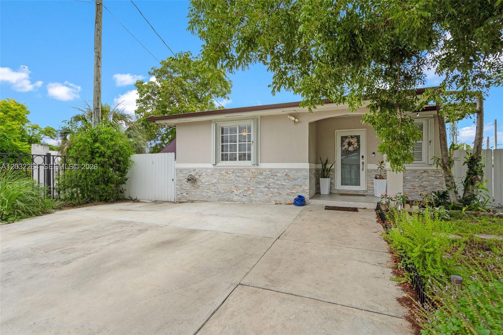 Exceptionally maintained 3-bedroom, 2-bath home situated on a desirable corner lot with NO HOA! This move-in-ready property features a roof and A/C less than 2 years old, solar-powered attic vents, impact-rated exterior doors, and accordion hurricane shutters. The remodeled kitchen showcases wood cabinetry, two Lazy Susan corner cabinets, a pantry with sliding pull-out drawers, and a concealed dishwasher. A custom built-in floating entertainment center adds style and functionality to the living area.

The fully fenced yard offers exceptional versatility with two automatic remote-controlled gated entrances, providing ample space for multiple vehicles, boats, RVs, trailers, and work equipment. Additional outdoor features include a dedicated dog run with three gated access points and a large 16' x 10' storage shed.

Conveniently located near shopping, restaurants, schools, major highways, the South Dade Busway, Downtown Homestead, the Florida Keys, and Everglades National Park, this home offers the perfect blend of security, functionality, privacy, and location.