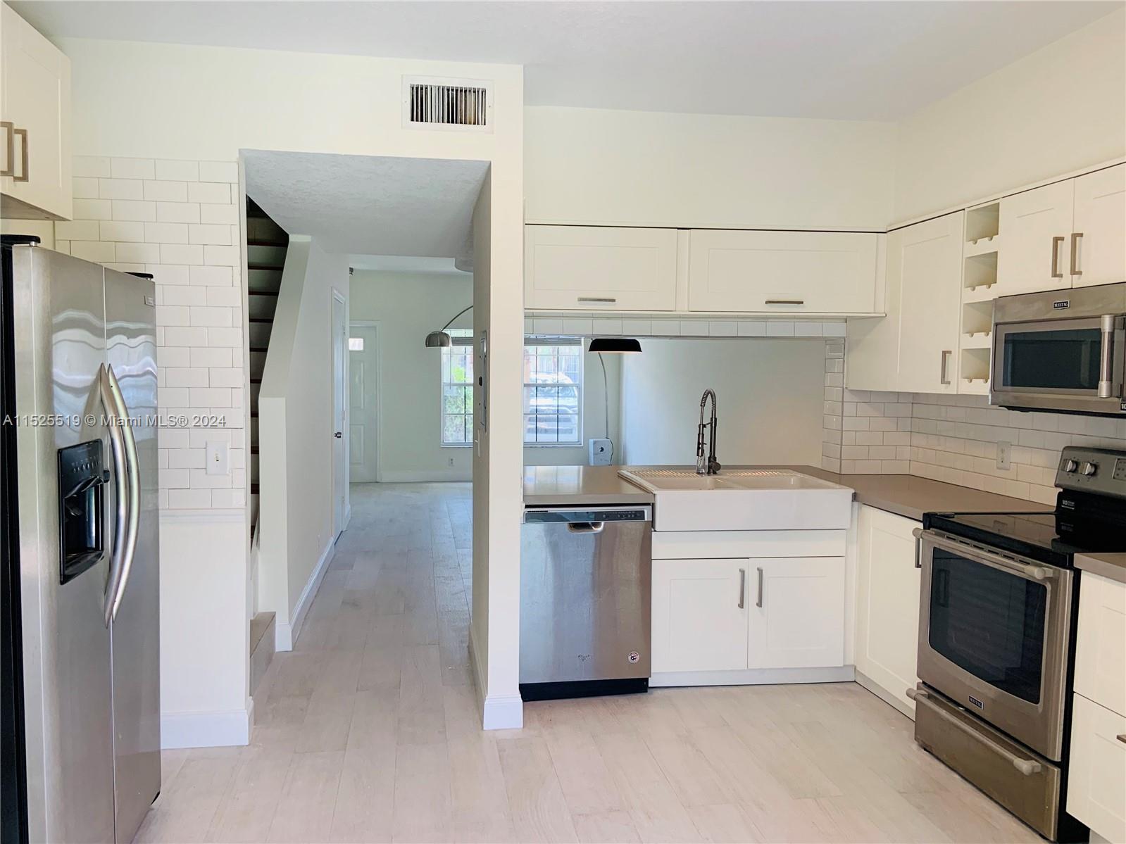 This beautifully updated 2-bedroom townhouse in Coconuts, Weston, is your key to comfortable living. Step inside a fresh, inviting space with newly painted walls and modern touches throughout. Fully updated kitchen featuring sleek stainless steel appliances, ample storage, and a washer & dryer for convenience.
Relax on the enclosed porch with sliding glass doors, opening to a large grassy area perfect for BBQs or quiet moments. Enjoy the ease of ceramic tile flooring throughout, eliminating carpet hassles. Small furry friends are welcome to make this their home.

One assigned parking spot with non-commercial trucks allowed. includes: Basic cable, yard maintenance, and access to pools and Bonaventure Town Center amenities & relaxation options. No HOA approval, move in right away!