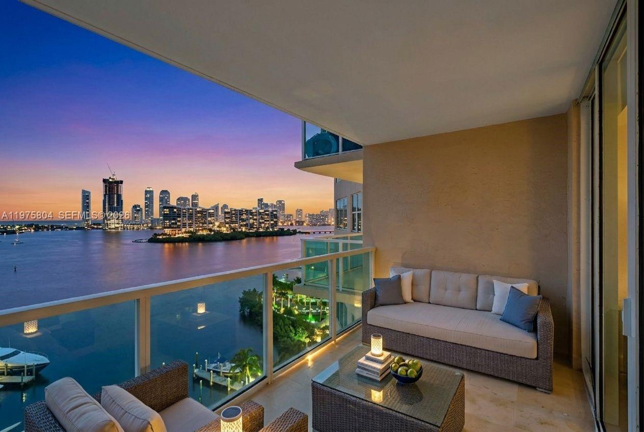 Breathtaking 12th-floor residence at the prestigious Aventura Marina II, offering sweeping, unobstructed 180° views of the Atlantic Ocean, Intracoastal Waterway, and city skyline. Spanning an expansive 2,020 SF, this split-floor plan features a versatile den that can easily convert into an open flex space or a spacious 3rd bedroom. Designed for maximum privacy, the generous bedrooms are situated far away from one another; both offer massive walk-in closets and large en-suite baths with dual sinks, living almost like a dual primary suite setup. Fully reimagined for modern living, this is a fully integrated smart home—every outlet, light switch, fan, and chandelier is wired to Wi-Fi for seamless remote control. The open kitchen features granite countertops and ample cabinetry. Enjoy resort-style amenities: 2 pools, state-of-the-art fitness center, 24-hr guard-gated security, valet, yacht club, and on-site boat docks. Minutes from Aventura Mall, fine dining, beaches, and major highways. Click "View Virtual Tour" for your interactive lifestyle concierge. Explore everything!