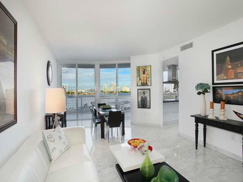 Trump Royale featuring a spacious 12th floor looking over the City street scape, and bay. No expense has been spared on the interior renovations - upon entering, you notice the gorgeous Calcutta marble throughout including designer detailed finishes and f urnishings. It is truly an awesome floor plan! Watch a tennis match below. The resort amenities at Trump Grande development are endless and you will find this to be the ultimate place to call home. Storied Location. Exquisite Living. Remarkable Life.