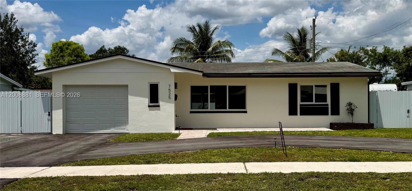 Stunning totally renovated! Enjoy peace of mind with new impact windows and doors, brand new electrical system, and high-end finishes throughout.  Featuring a modern kitchen with waterfall countertop, new bathrooms, new flooring and baseboards and new recess lighting and stylish fixtures throughout the home.  New fence with double gates on one side (for vehicle access) and a single gate on the other side.  Freshly painted inside and out!  Extra feature ... the garage has been converted to a bedroom with separate entrance - ideal for 3rd bedroom, guests, home office, or income-producing opportunity.  Must See! 

Roof: 2012 - Air Conditioning System 2020 - WaterHeater 2024 - Termite Tented - 2026
